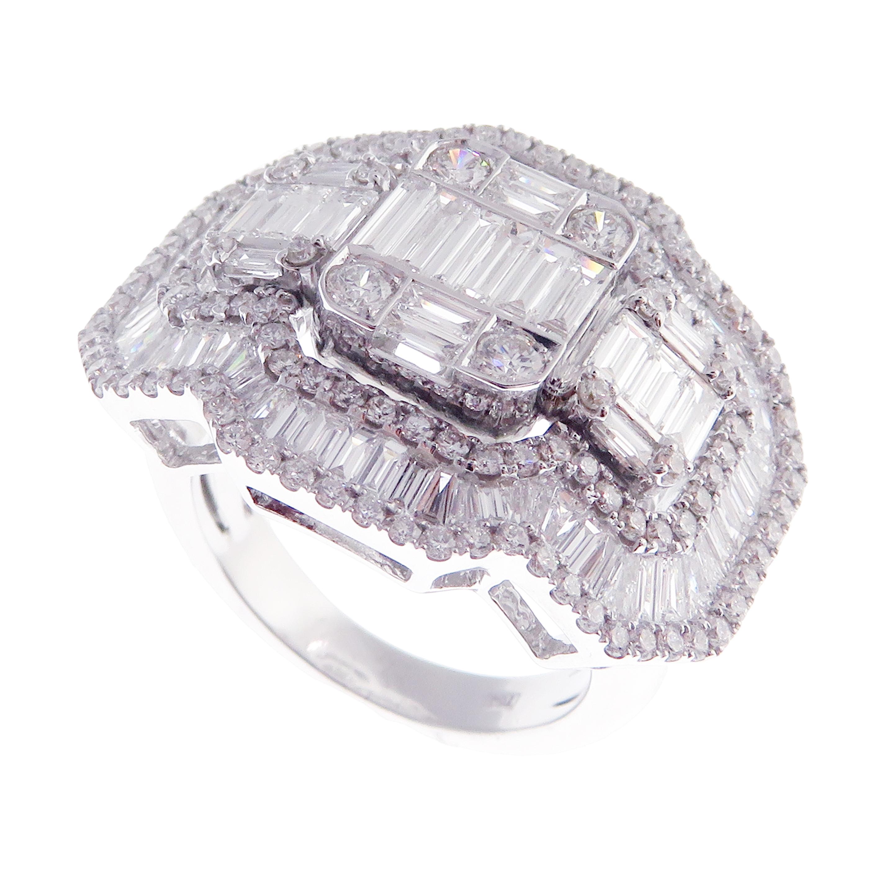 This baguette, diamond ring is crafted in 18-karat white gold, weighing approximately 3.32 total carats of SI-V Quality white diamonds. This ring is comfortable and can be sized 