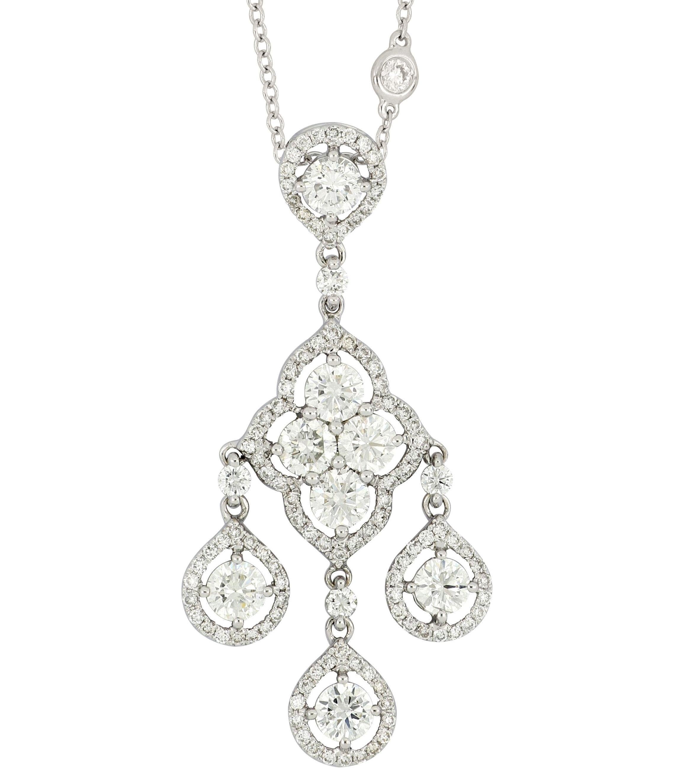 A beautiful diamond chandelier pendant with necklace, set with diamonds weighing 2.9 carats, mounted in 18 Karat white gold. The dangling pendant is composed of brilliant-cut diamonds with a floral pattern in the centre  suspending three clusters of