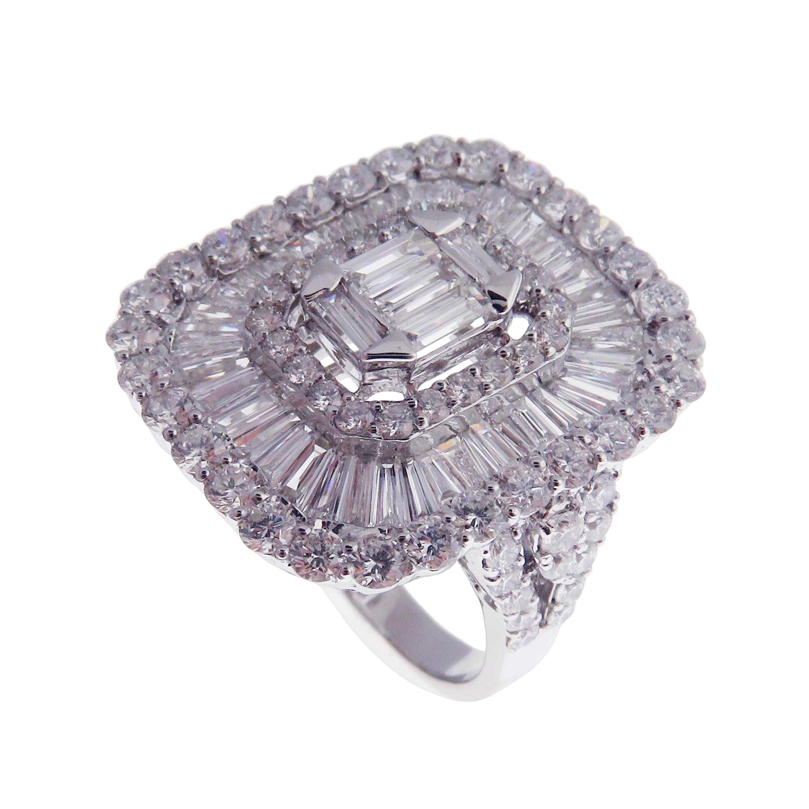 This baguette, diamond ring is crafted in 18-karat white gold, weighing approximately 3.56 total carats of SI-V Quality white diamonds. This ring is comfortable and can be sized 