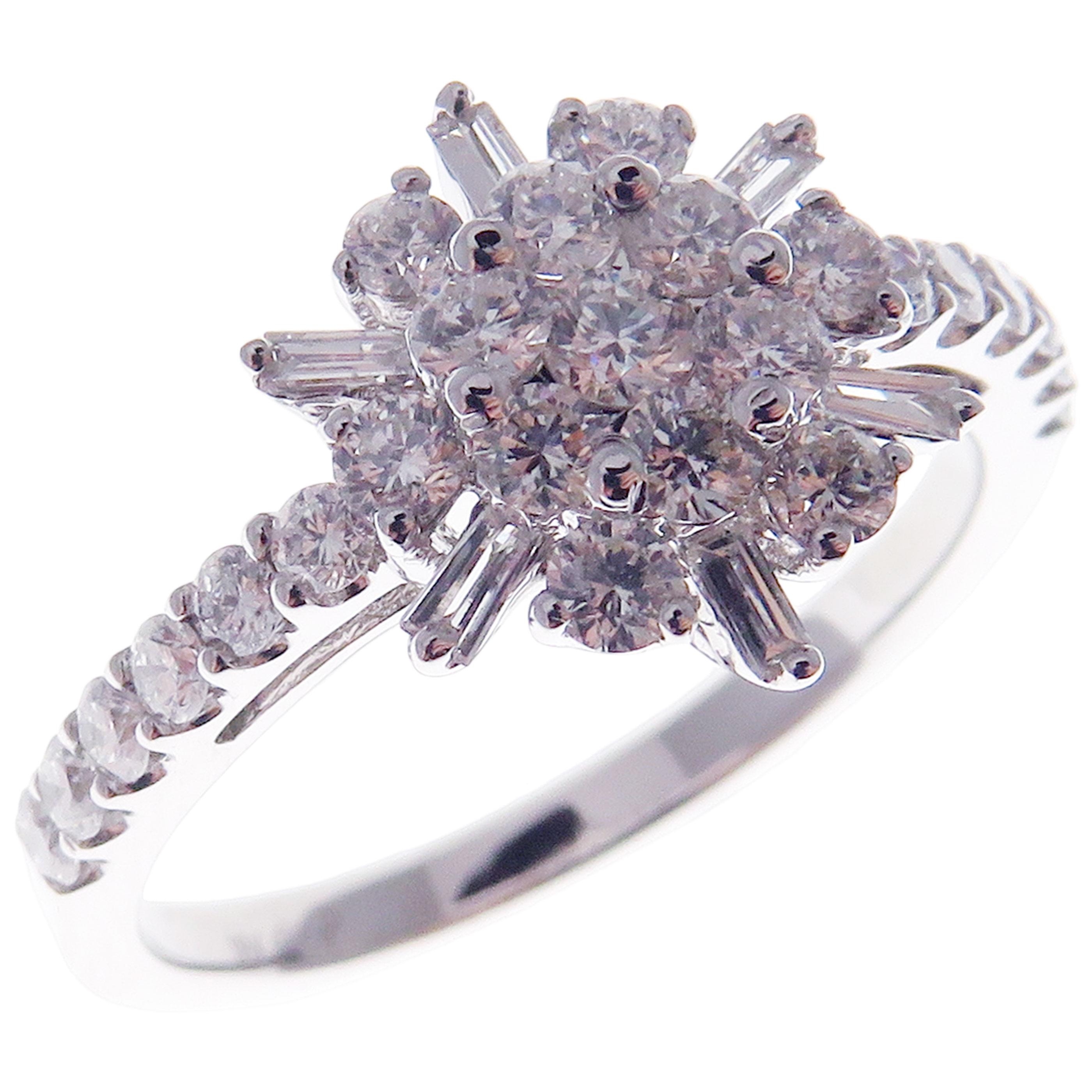 This trendy cluster snowflake inspired ring is crafted in 18-karat white gold, featuring 25 round white diamonds totaling of 0.83 carats and 6 baguette white diamonds totaling of 0.09 carats.
Approximate total weight 2.97 grams.
Standard Ring size