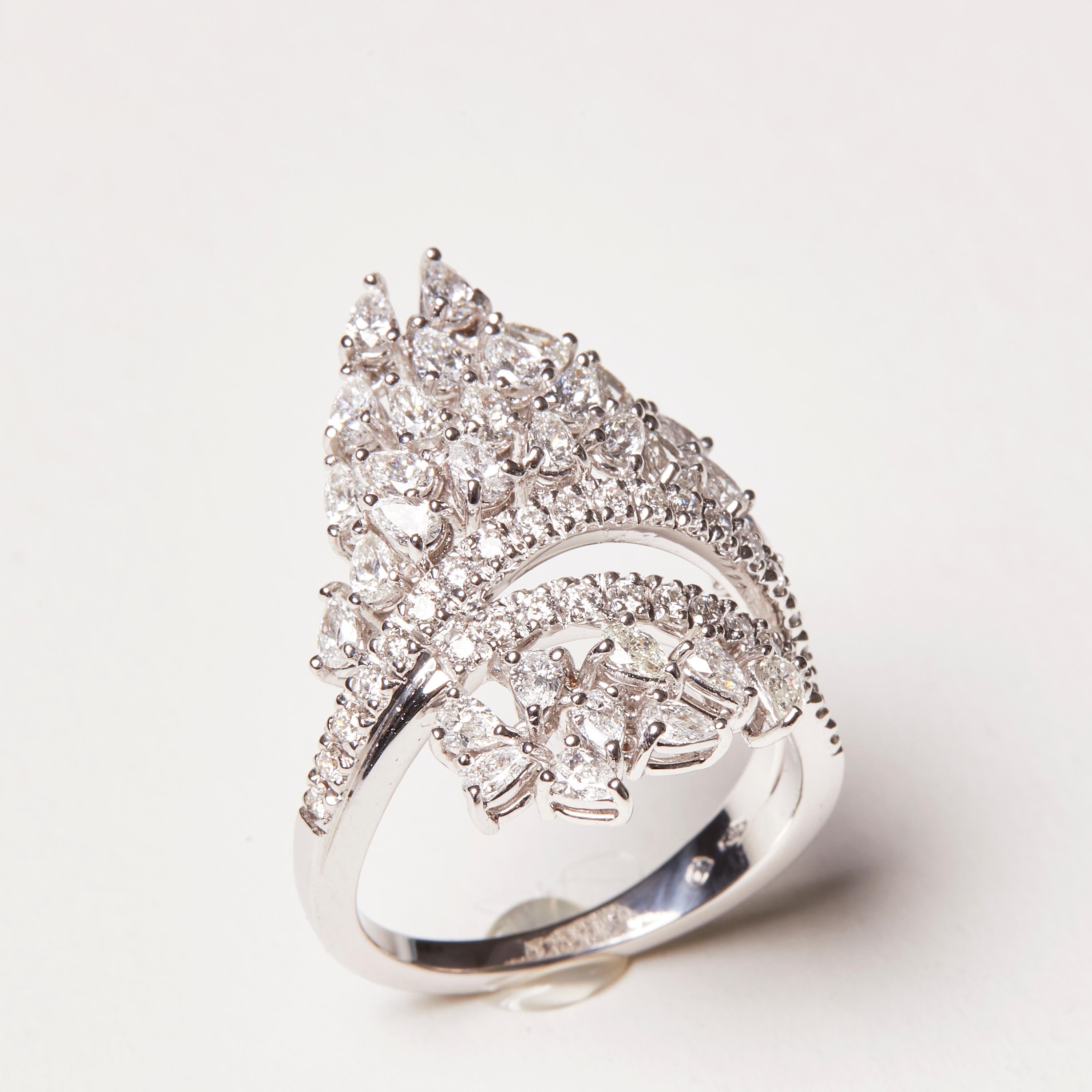 This 18 Karat White Gold Cocktail Ring is embellished with a over 70 diamonds - making everyone envious of you! This is your perfect go to piece for any special evening event and can be combined to any type of apparel. 


31 Diamonds 0.37 Carat
40