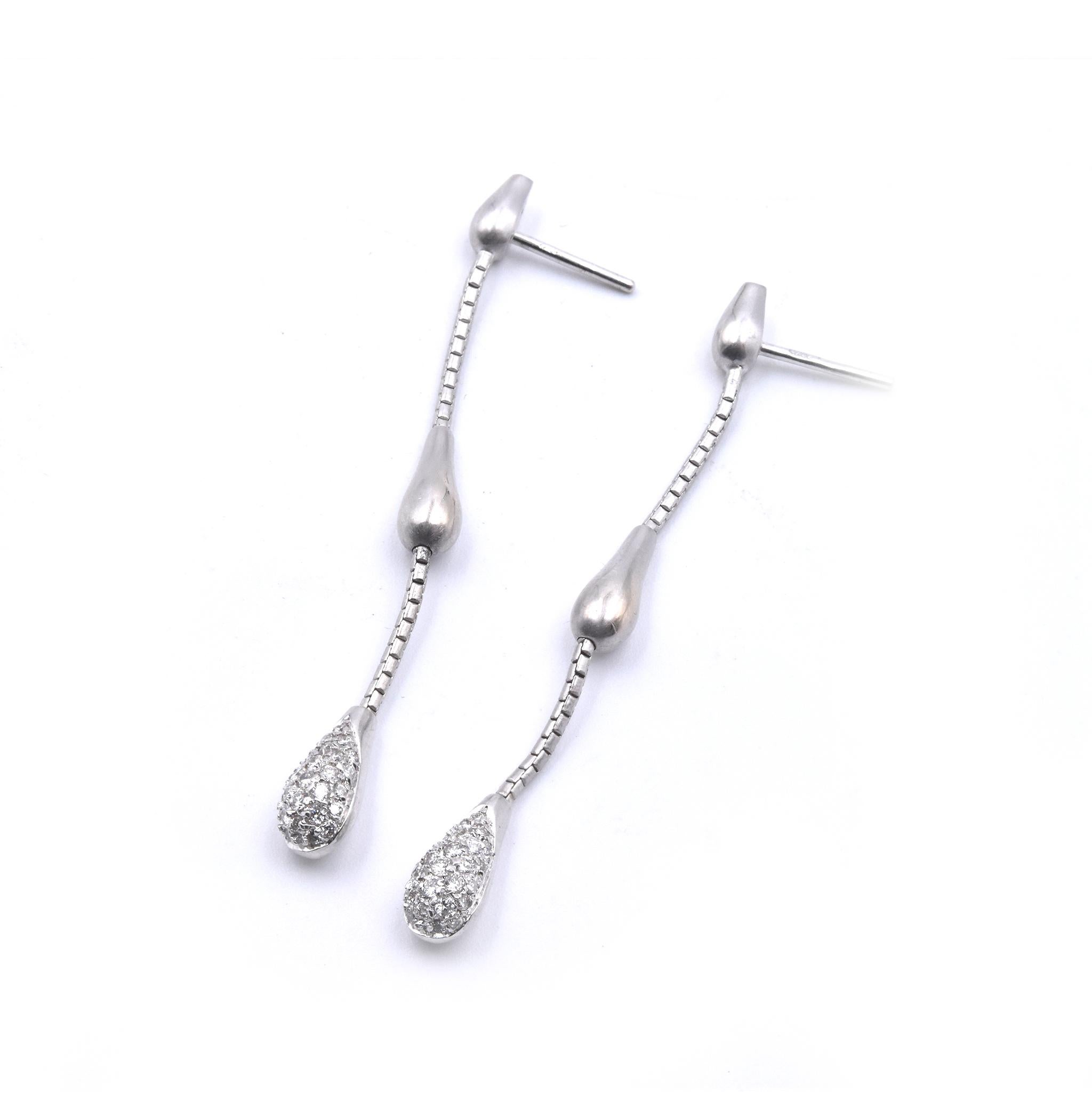 Designer: custom
Material: 18k white gold
Diamonds: 44 round brilliant cuts = 0.44cttw
Color: G 
Clarity: VS
Dimensions: earrings measure 53.5mm x 5.06mm
Fastenings: posts with friction backs 
Weight: 8.27 grams
