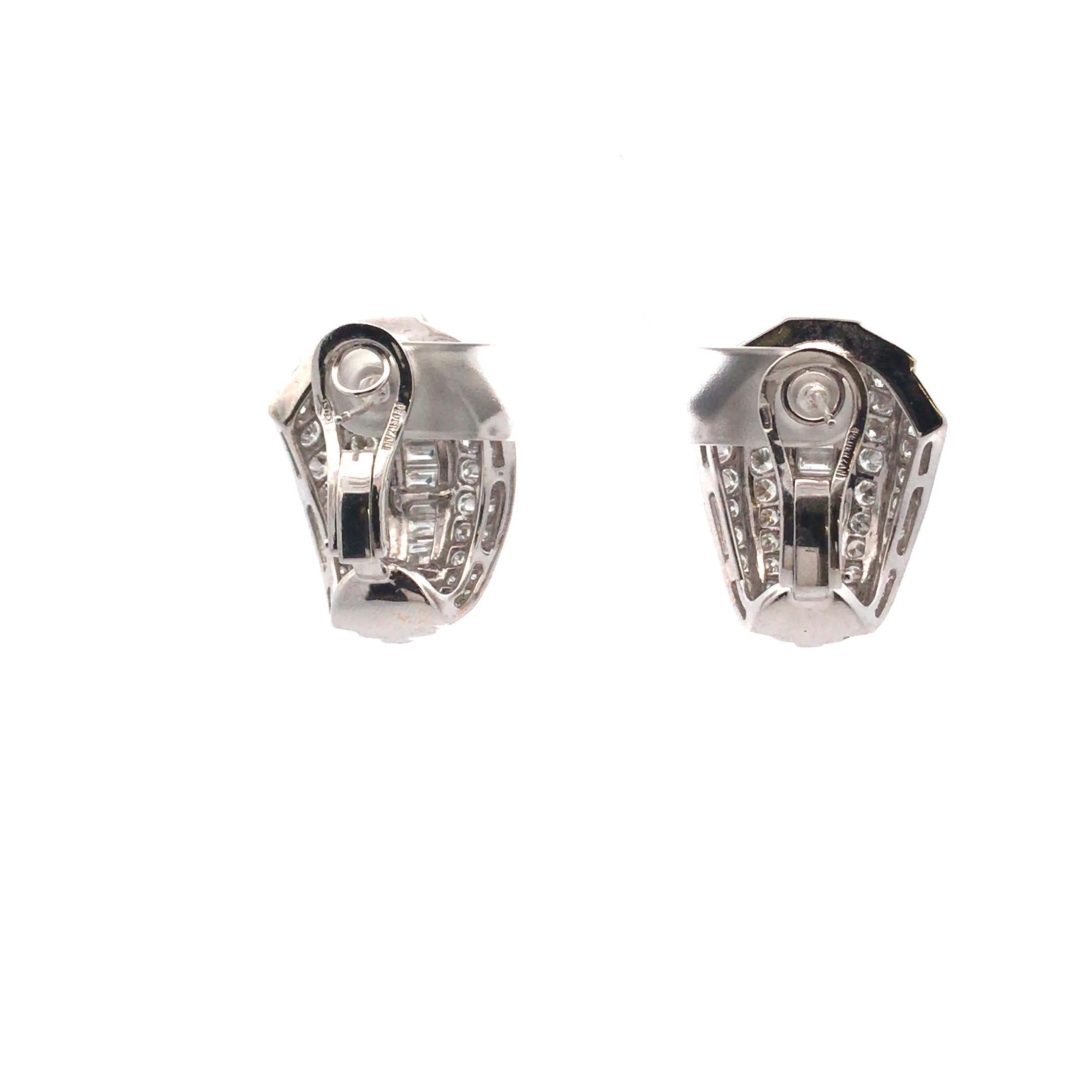 Set in 18 Karat White Gold, weighing 21.29 grams. The Earrings is further enhanced with a total of 92 Round Brilliant Cut and 30 Baguette cut diamonds weighing approximately 13.52 carats total weight, 
Color Range of: F-S, Clarity Grade of: VSS-2.