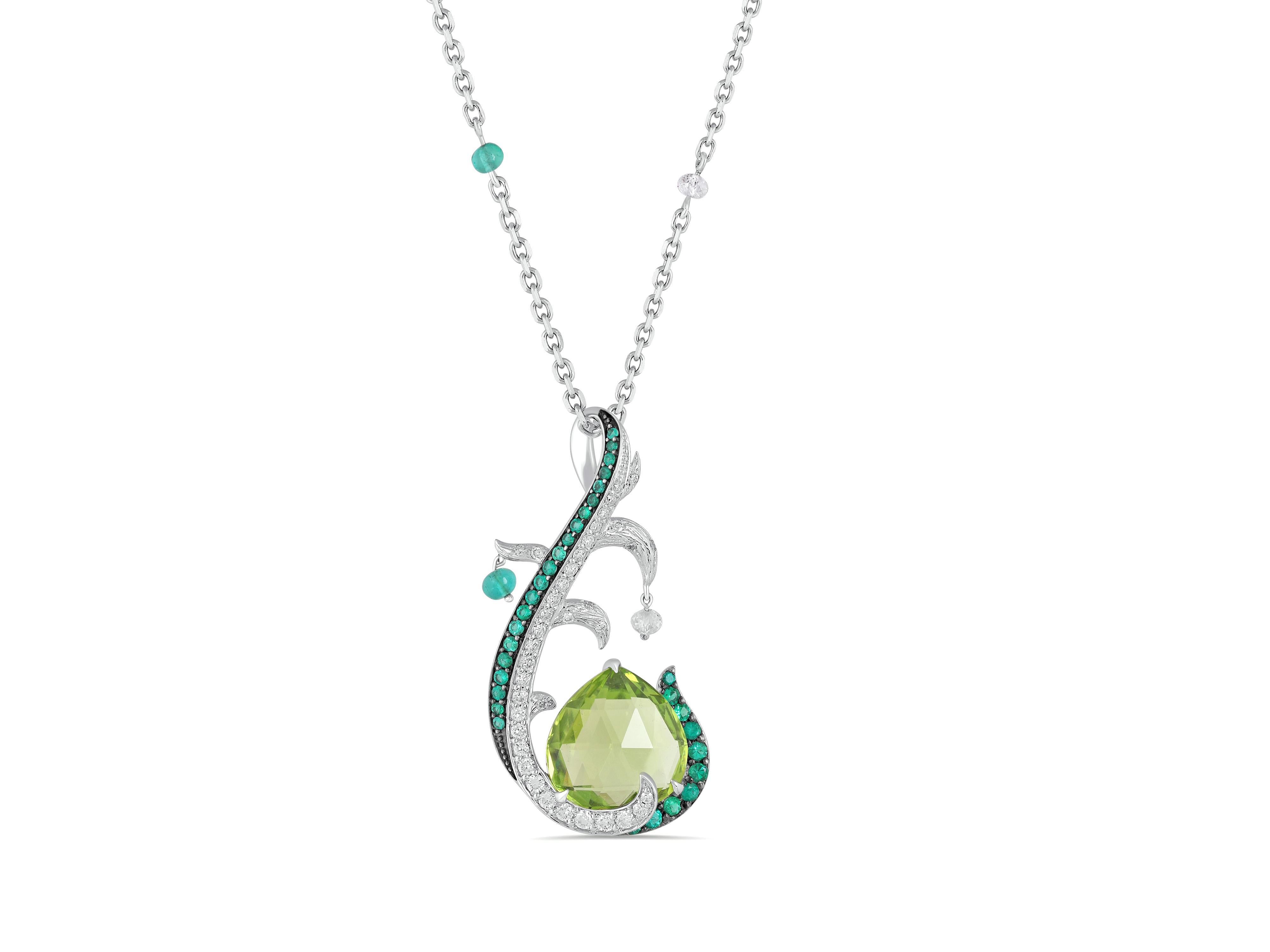 Faceted peridot drops form the centre piece of this tree-inspired pendant in 18 karat white gold.

Emerald and diamond beads hang on the branches, that have been textured to resemble the surface of a tree’s trunk.

Round, brilliant cut diamonds and