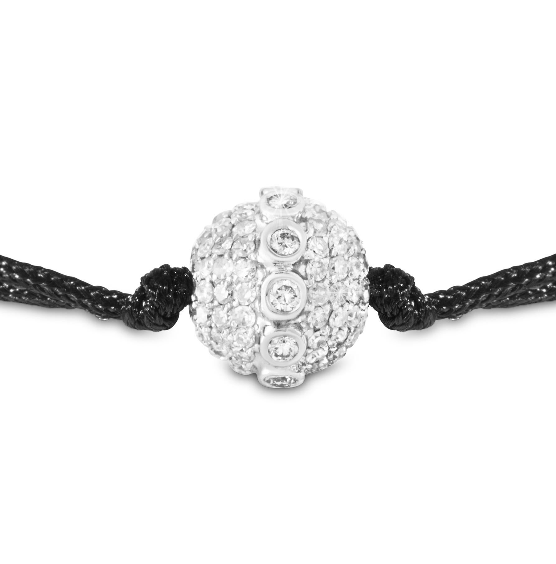 A new take on a classic one size bracelet by representing THEVAULT15's handmade free turning 18-karat white gold Signature Infinity Orb. A special Orb encrusted with sparkling diamonds and a centered diamond belt representing infinity. Each bead is