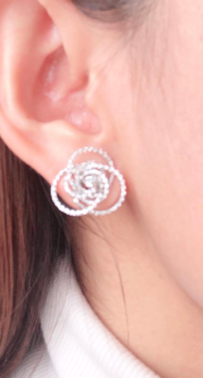 Round Cut 18 Karat White Gold Diamond Flower Swirl Stud Earrings by H2 at Hammerman For Sale