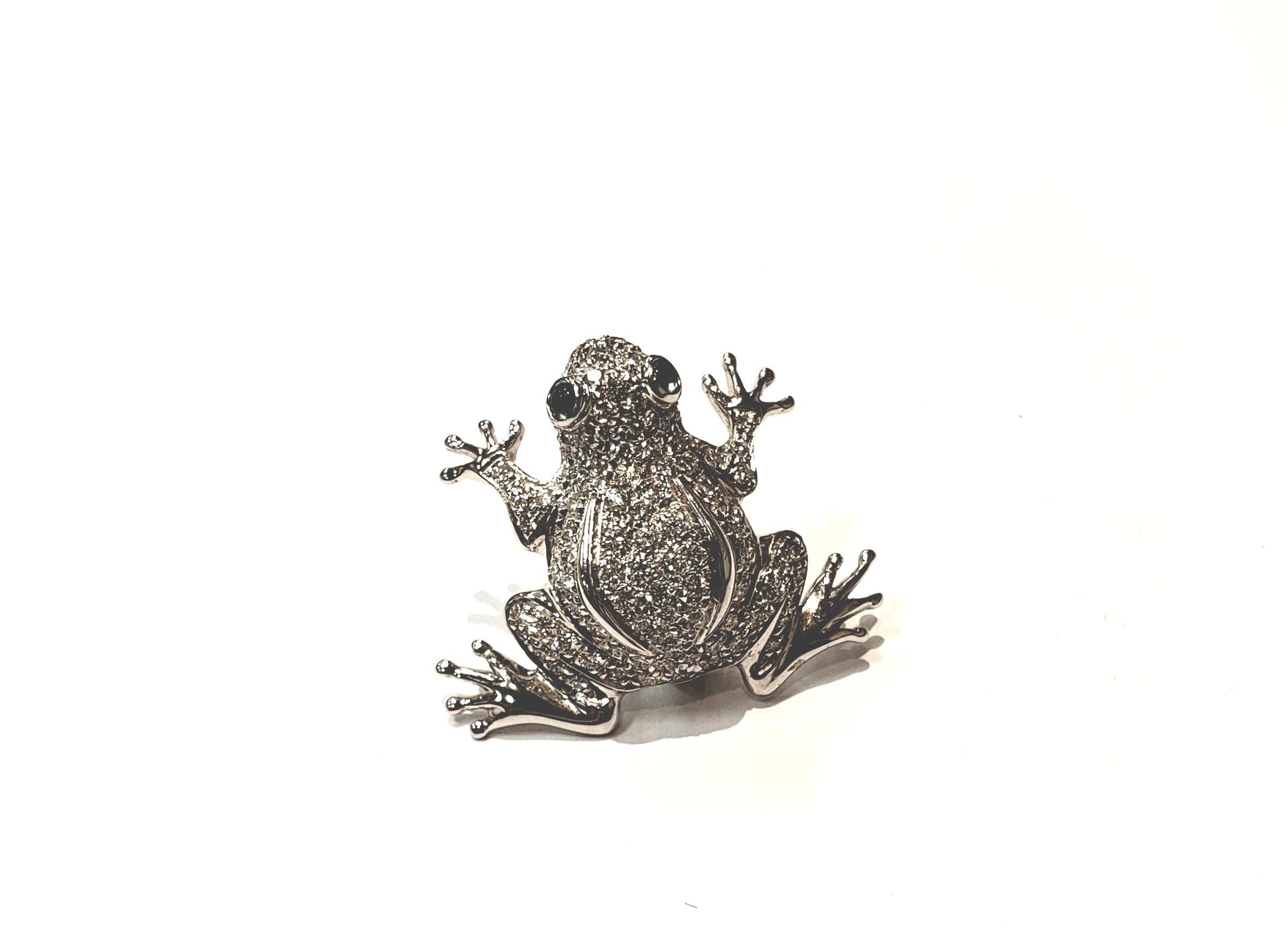 An Adorable Frog Pin Done In 18 Karat White Gold And Pave Set Diamonds, With Cabochon Emerald Eyes.
Pin Is 1 Inch In Length & 1 Inch Across At Widest. This Little Frog Could Hop On Any Outfit And Add A Whimsical Touch!
Pin Is By Italian Jeweler Aldo