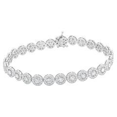 Pulsera en línea con halo de diamantes en oro blanco de 18 quilates