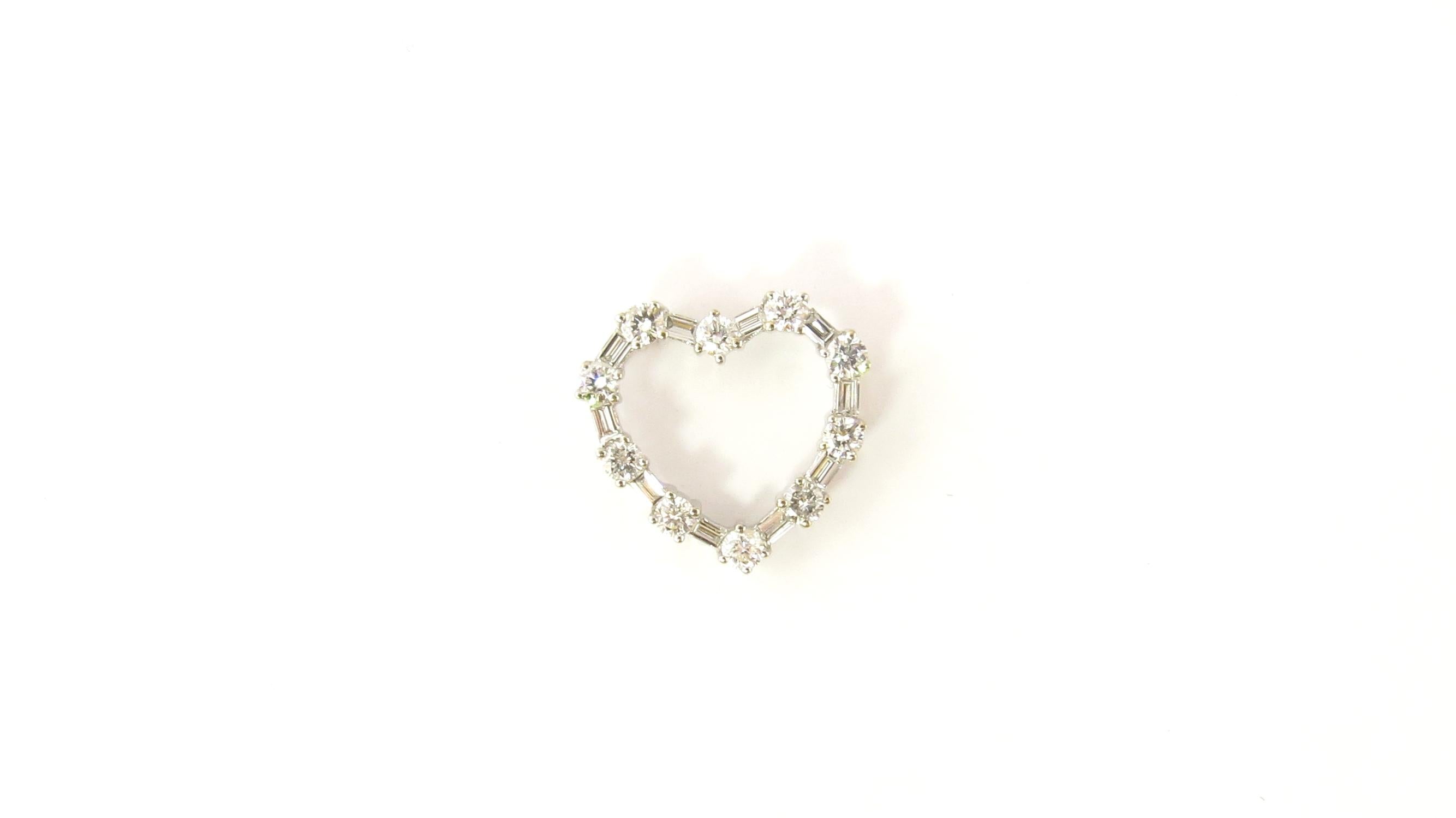 Vintage 18 Karat White Gold Diamond Heart Pendant

This dazzling heart pendant features ten round brilliant cut diamonds (.50 ct. twt.) and ten baguette diamonds (.50 ct. twt.) set in classic 18K white gold.

Approximate total diamond weight: 1