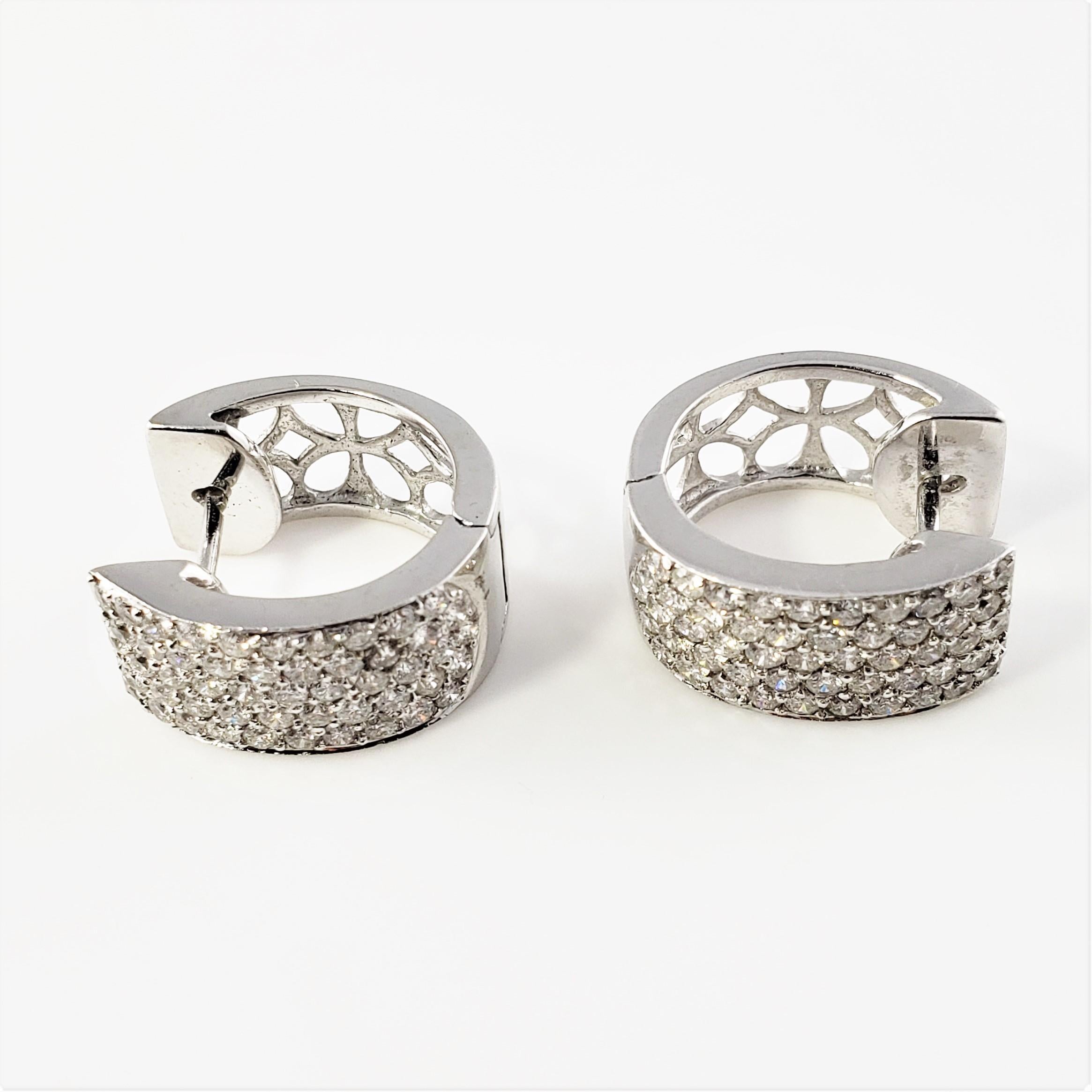 14 Karat White Gold and Diamond Earrings-

These sparkling hinged hoop earrings each feature 51 round brilliant cut diamonds set in beautifully detailed 18K white gold.  

Approximate total diamond weight:  1.54 ct.

Diamond color:  G-H

Diamond