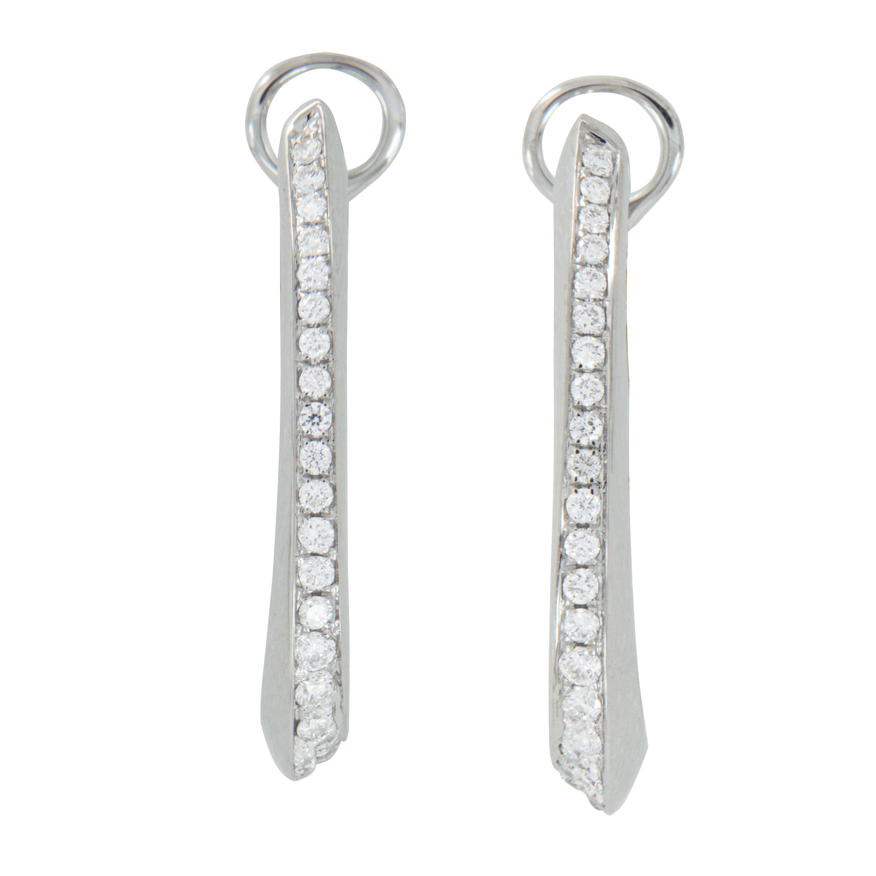 These are the perfect earrings to wear everyday and still be knockouts into the evenings! Made for Campanelli & Pear of fine 18 karat white gold in complimentary oval hoop shape with 0.36 Cttw diamonds pave' set in the ever so slight twist to really