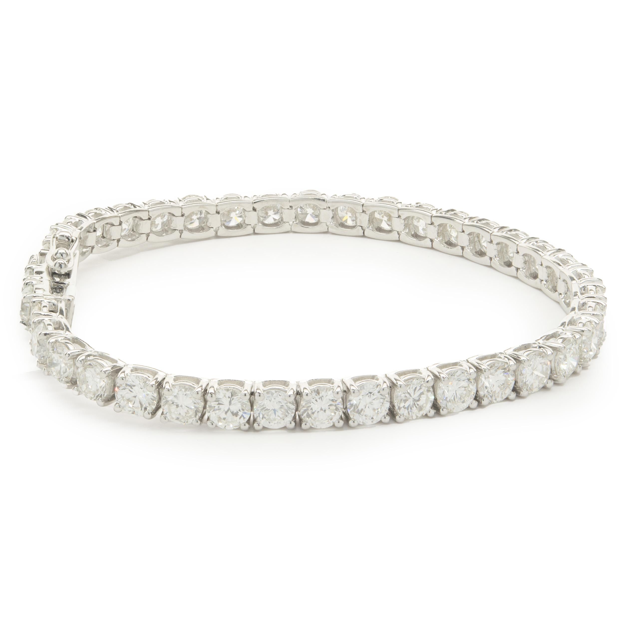 Material: 18K white gold
Diamonds: 39 round brilliant cut = 12.10cttw
Color: G / H / I
Clarity: VS2-SI1
Dimensions: bracelet will fit up to a 7-inch wrist 
Weight: 18.31 grams