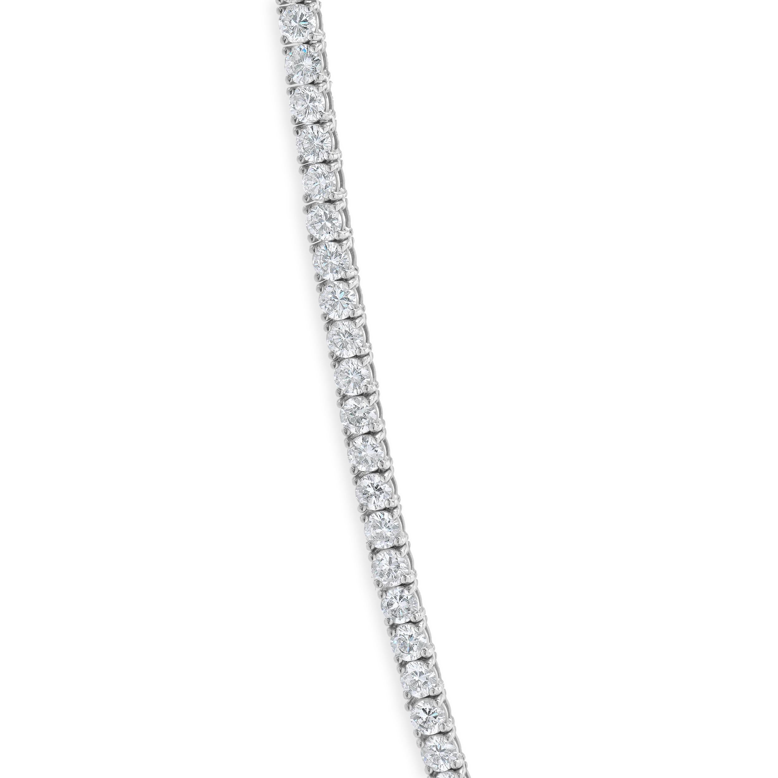 Designer: custom
Material: 18K white gold
Diamonds: 130 round brilliant cut = 14.01cttw
Color: H
Clarity: SI1
Dimensions: necklace measures 17-inches in length
Weight: 24.14 grams