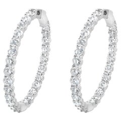 Pendientes de aro con interior y exterior de diamantes en oro blanco de 18 quilates