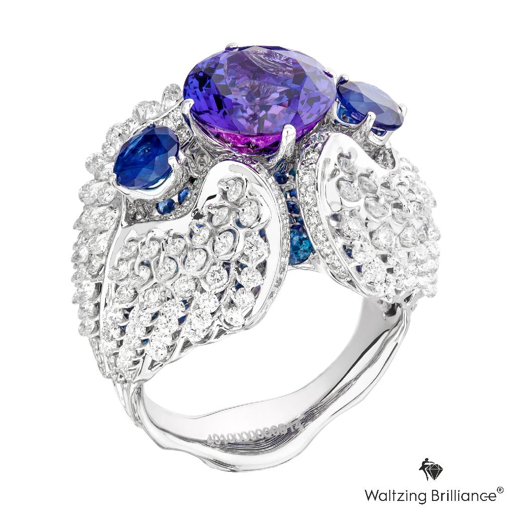 An  intensive blue Tanzanite is  mounted on angel feather diamond frame, employed patented gemstone setting 