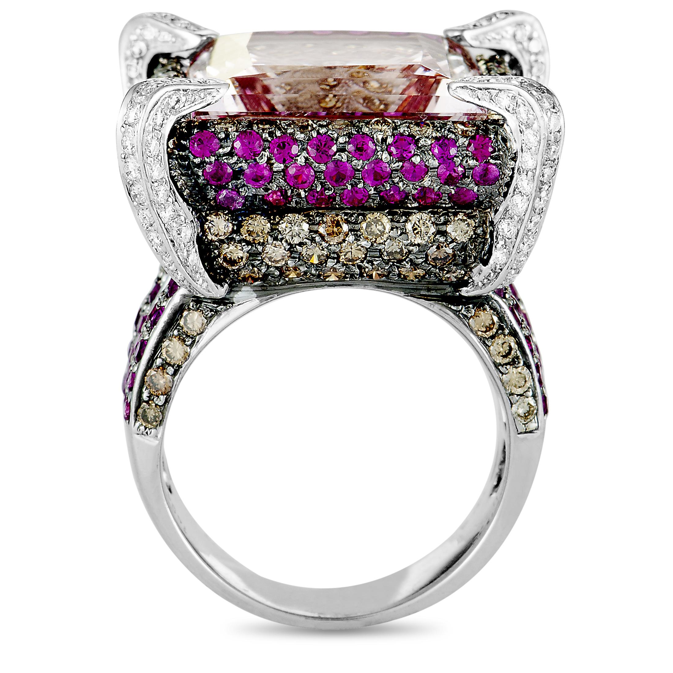 This ring is crafted from 18K white gold and set with rubies, a total of 2.25 carats of diamonds, and with a kunzite that weighs 14.94 carats. The ring weighs 19.3 grams, boasting band thickness of 5 mm and top height of 12 mm, while top dimensions