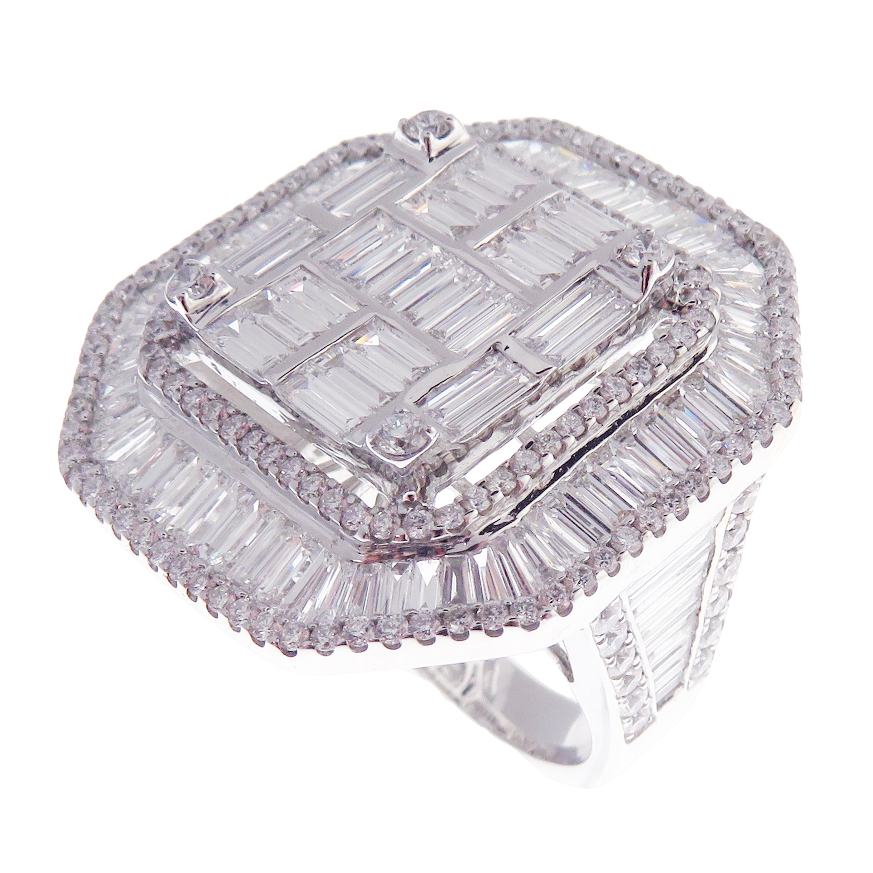 This baguette, diamond ring is crafted in 18-karat white gold, weighing approximately 5.80 total carats of SI-V Quality white diamonds. This ring is comfortable and can be sized 