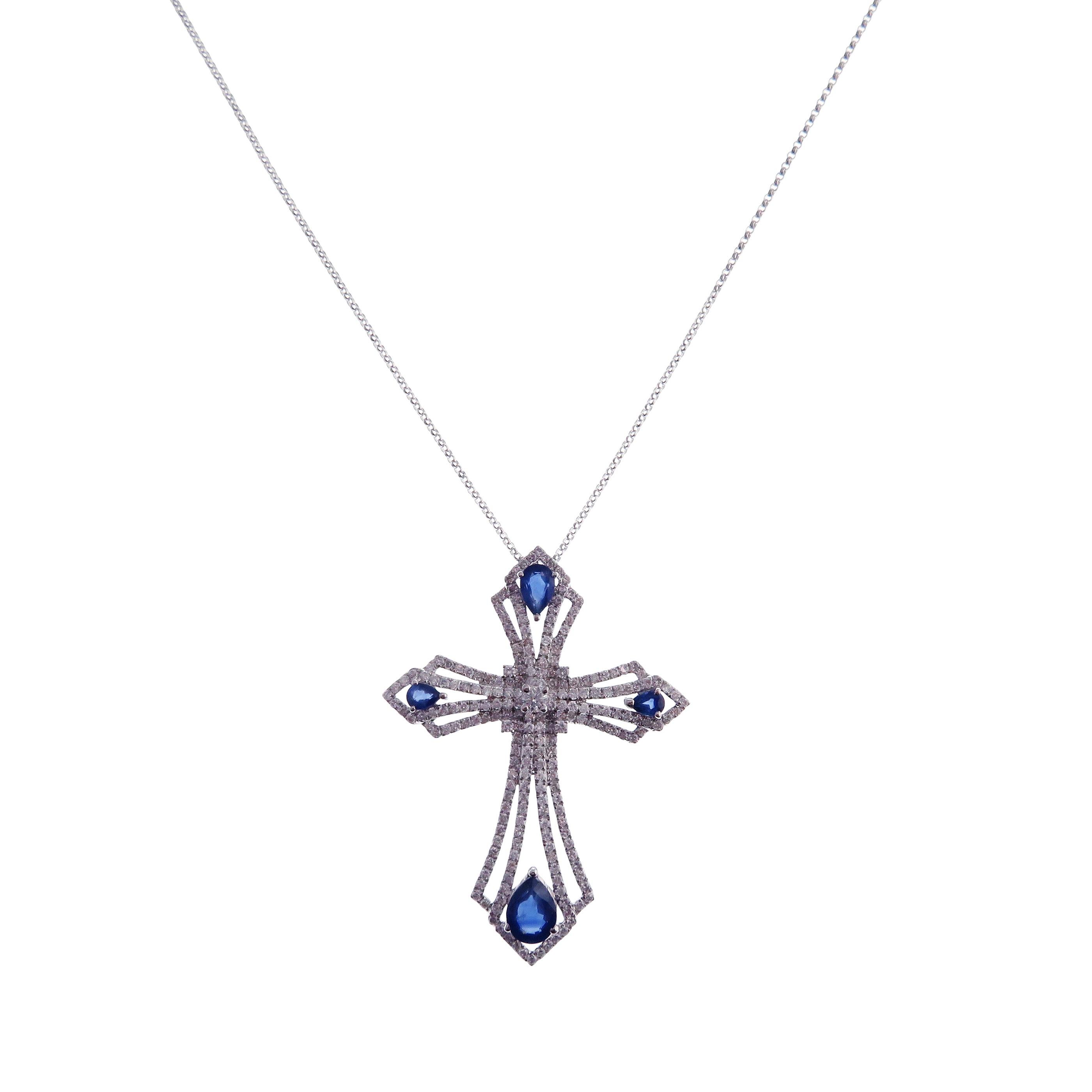 This cross motif necklace is crafted in 18-karat white gold, weighing approximately 1.90 total carats of SI Quality white diamond and 2.25 total carats of blue sapphires. 

Necklace is 16