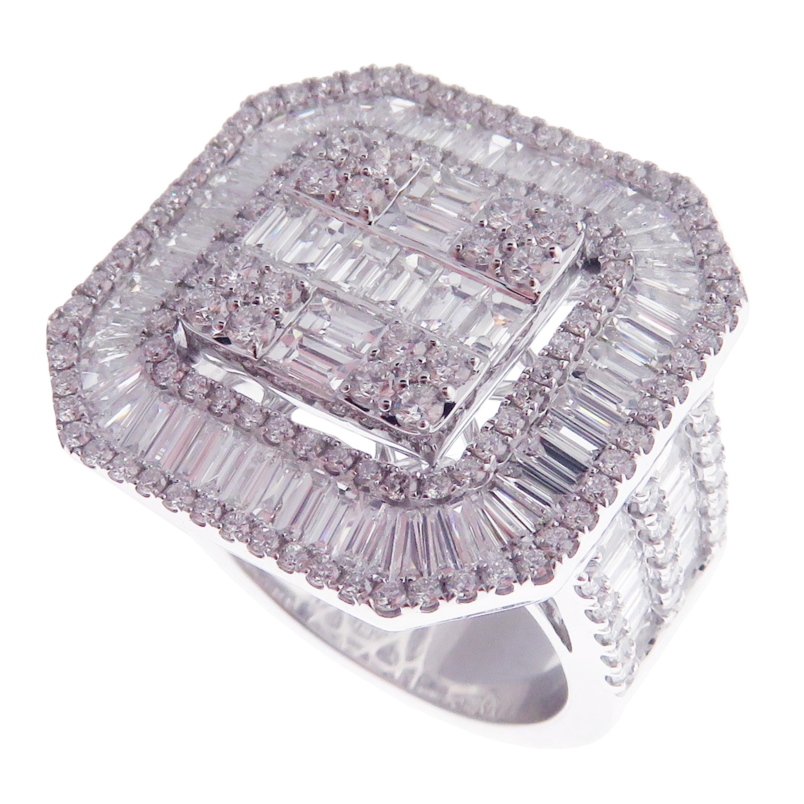This baguette, diamond ring is crafted in 18-karat white gold, weighing approximately 3.10 total carats of SI-V Quality white diamonds. This ring is comfortable and can be sized 