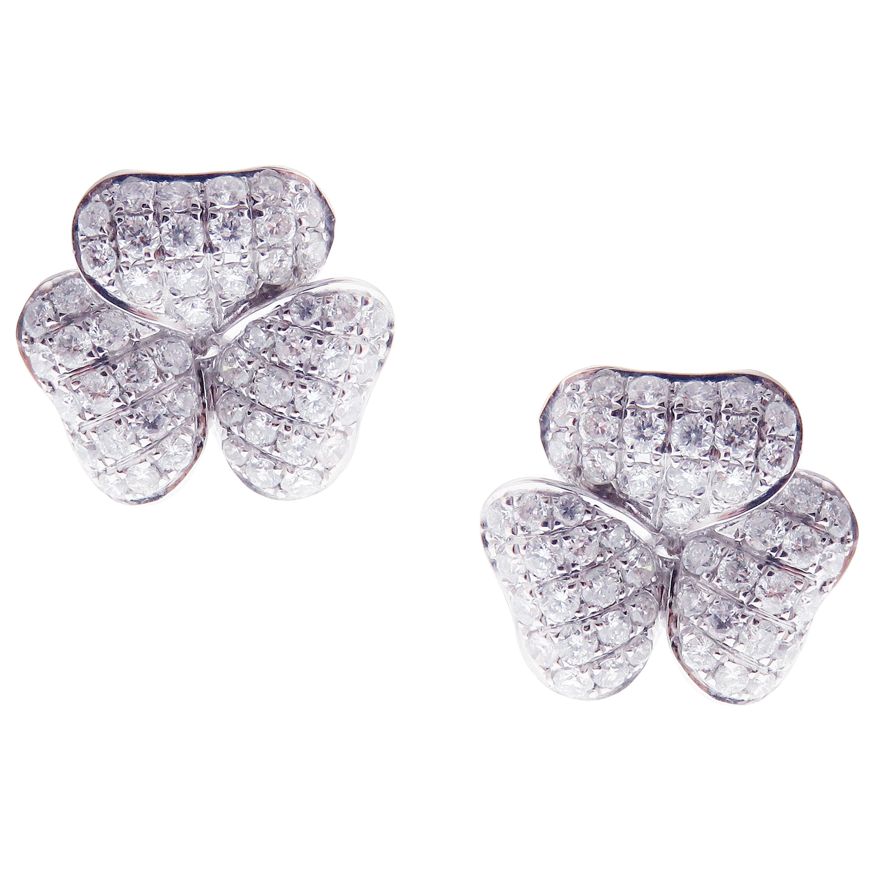 This medium diamond classic pave three petals flower earring is crafted in 18-karat white gold, featuring 102 round white diamonds totaling of 1.06 carats. 
Approximate total weight 3.90 grams.
These earrings come with push back post backings.
SI-G