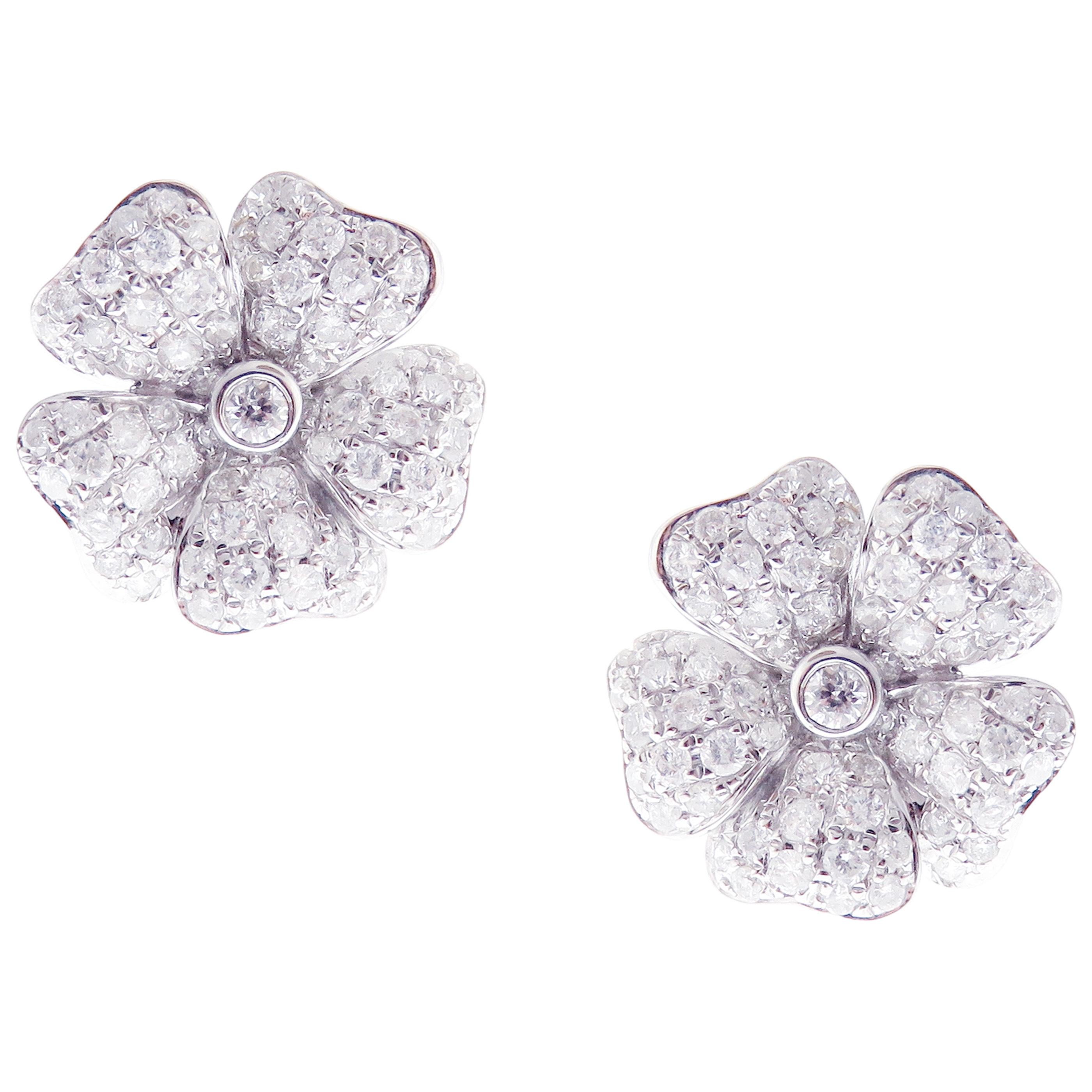 This medium diamond classic pave five petals flower earring is crafted in 18-karat white gold, featuring 144 round white diamonds totaling of 1.14 carats. 
Approximate total weight 4.30 grams.
These earrings come with push back post backings.
SI-G