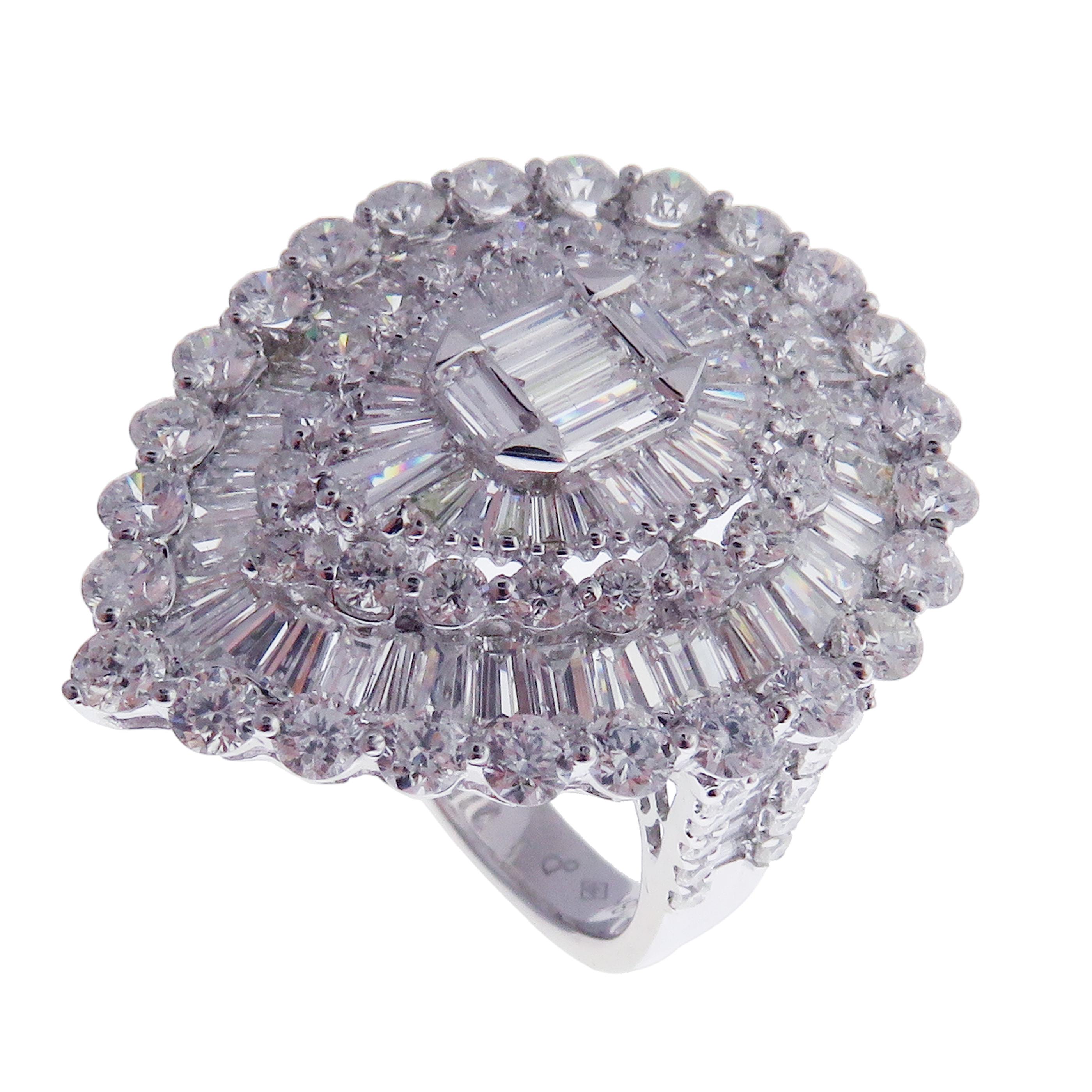 This baguette pear diamond ring is crafted in 18-karat white gold, weighing approximately 5.42 total carats of SI-V Quality white diamonds. Diamond embellishments on ring shank and a modern design brings out the beauty of the ring. This ring is
