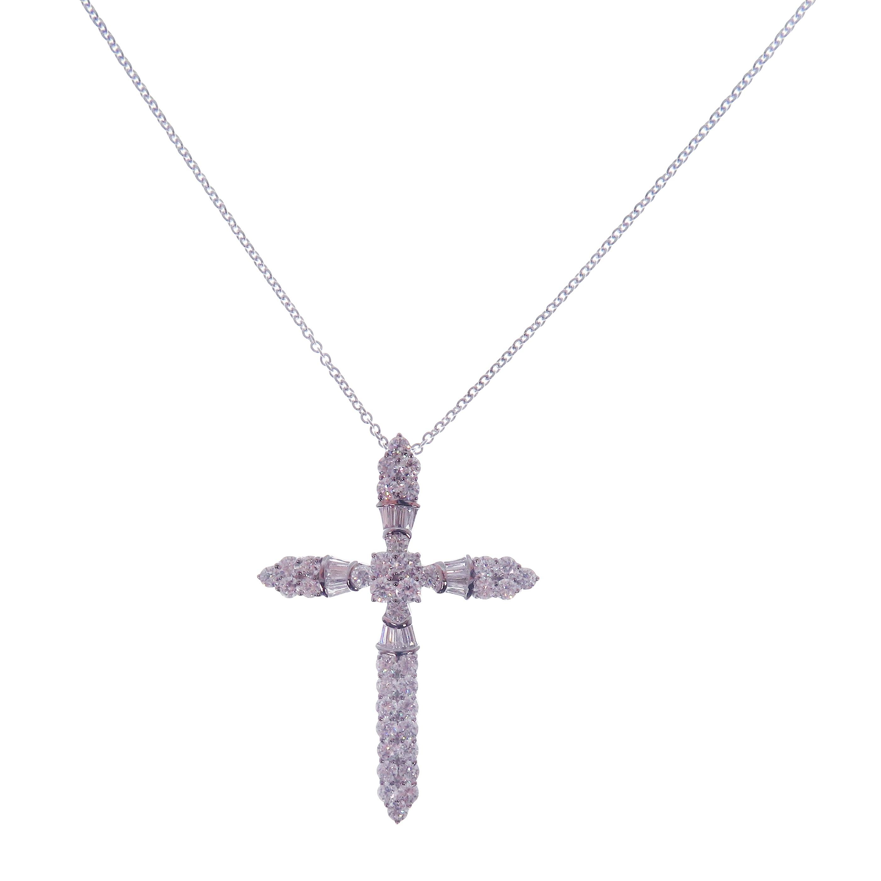 This diamond large cross necklace is crafted in 18-karat white gold, weighing approximately 1.95 total carats of SI-H Quality white diamonds.

Necklace is 16