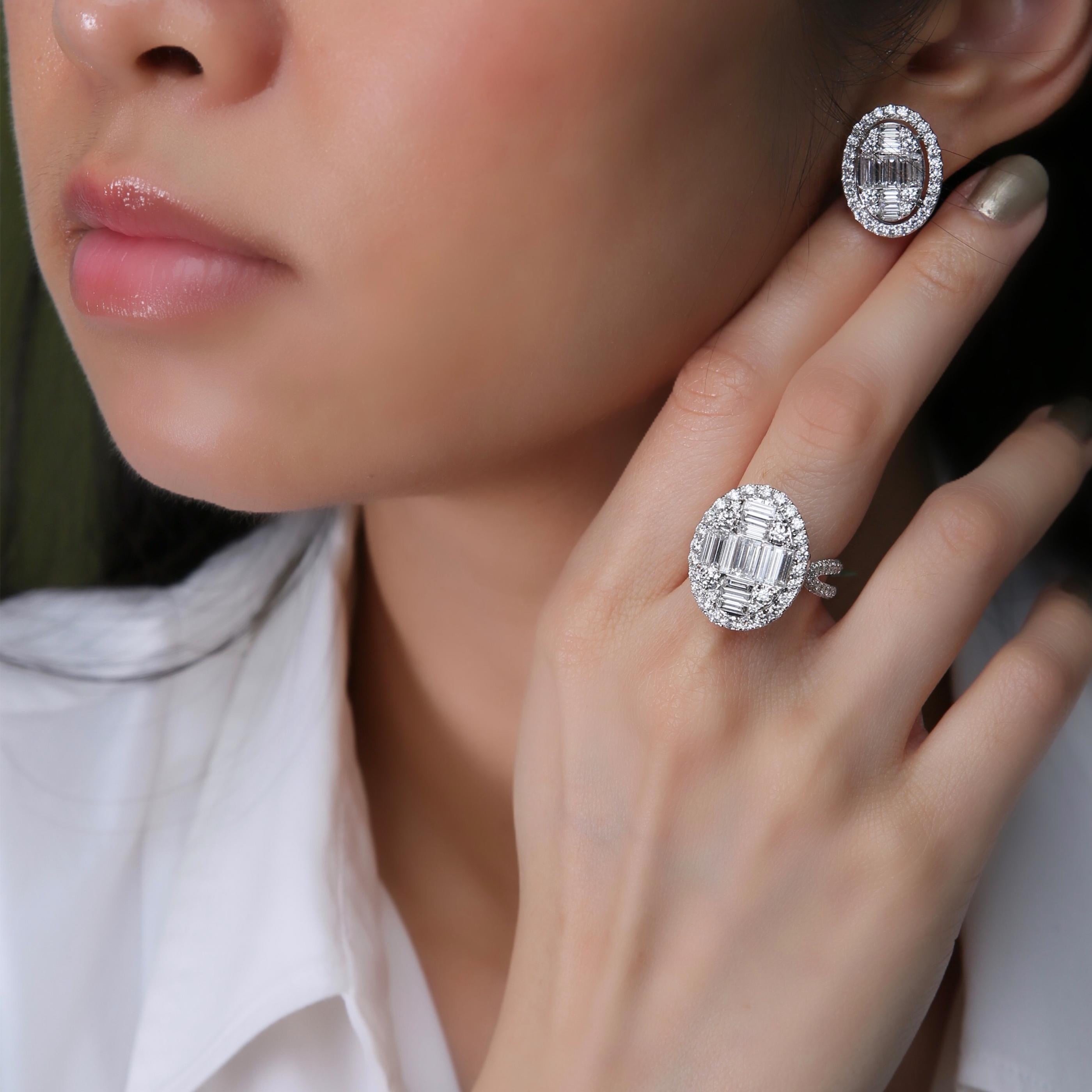 This medium diamond earring and ring set is crafted in 18-karat white gold, weighing approximately 5.86 total carats of SI-V Quality white diamonds. The ring is comfortable and can be sized 