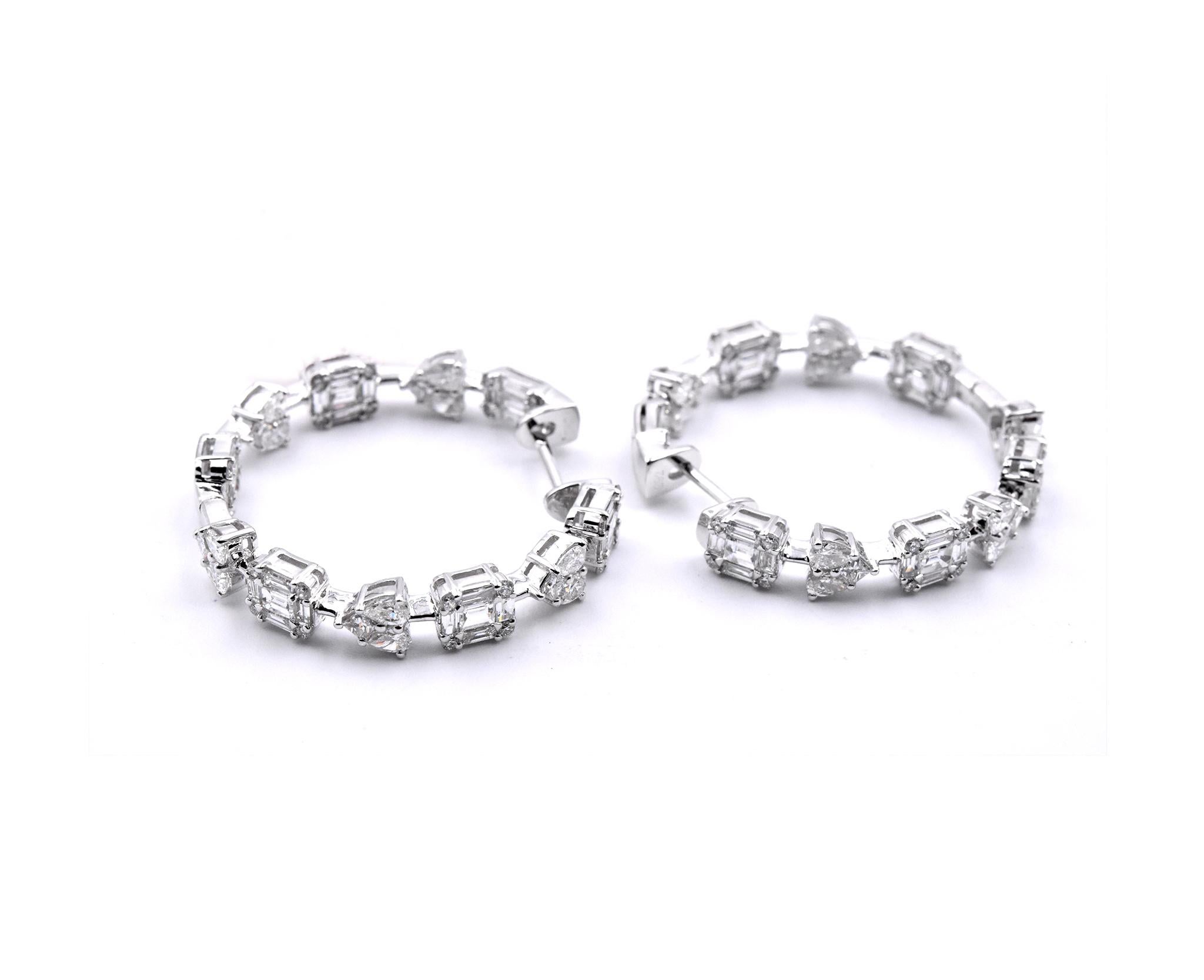 Material: 18k white gold
Diamonds:  56 round brilliant cuts = 1.07cttw
Color: G
Clarity: VS
Diamonds: 80 baguette cuts = 2.25cttw
Color: G 
Clarity: VS
Dimensions: earrings measure 31.00mm by 5.13mm
Fastenings: post with locking back
Weight: 9.08