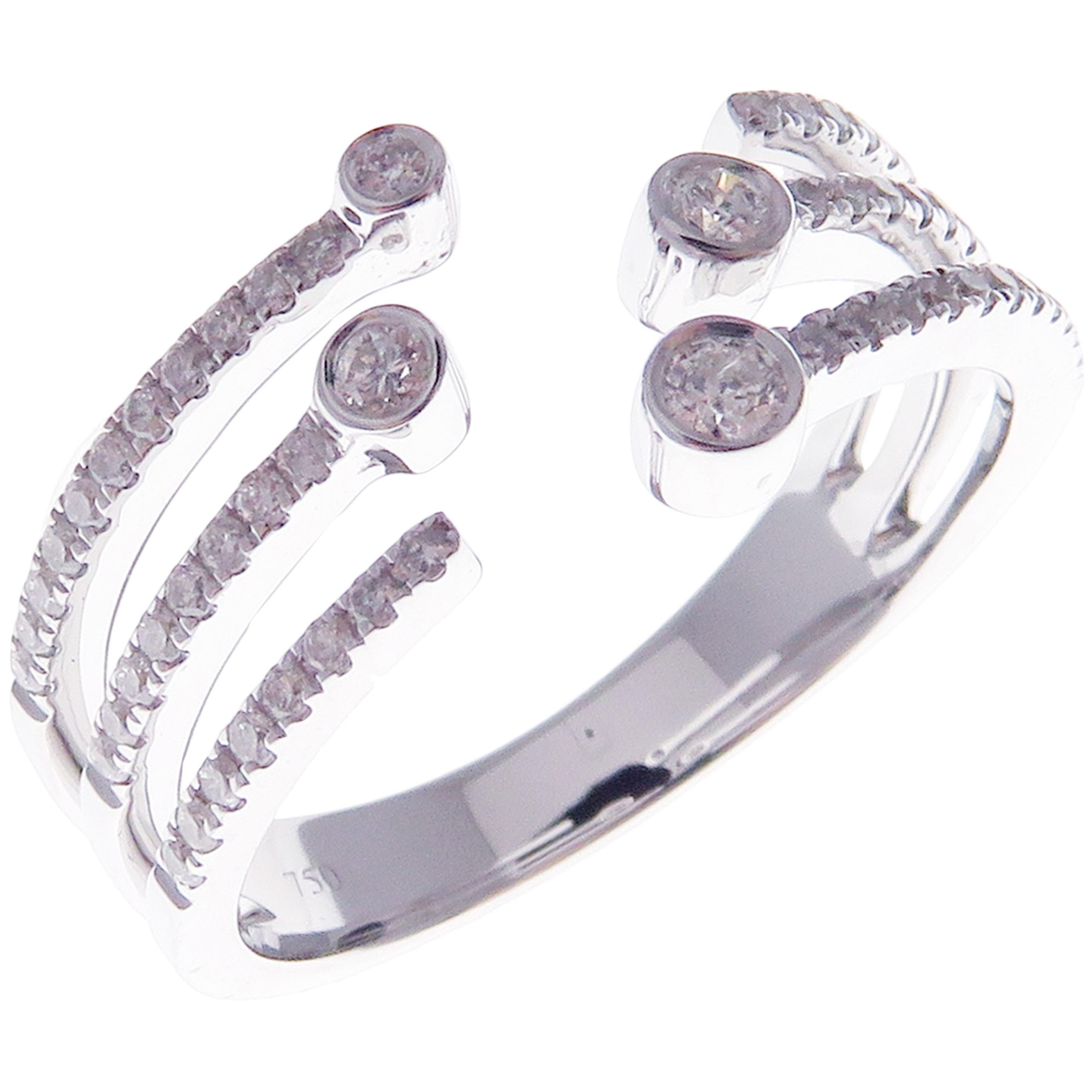 This trendy multi-layer open ring is crafted in 18-karat white gold, featuring 57 round white diamonds totaling of 0.34 carats.
Approximate total weight 4.41 grams.
Standard Ring size 7
SI-G Quality natural white diamonds.