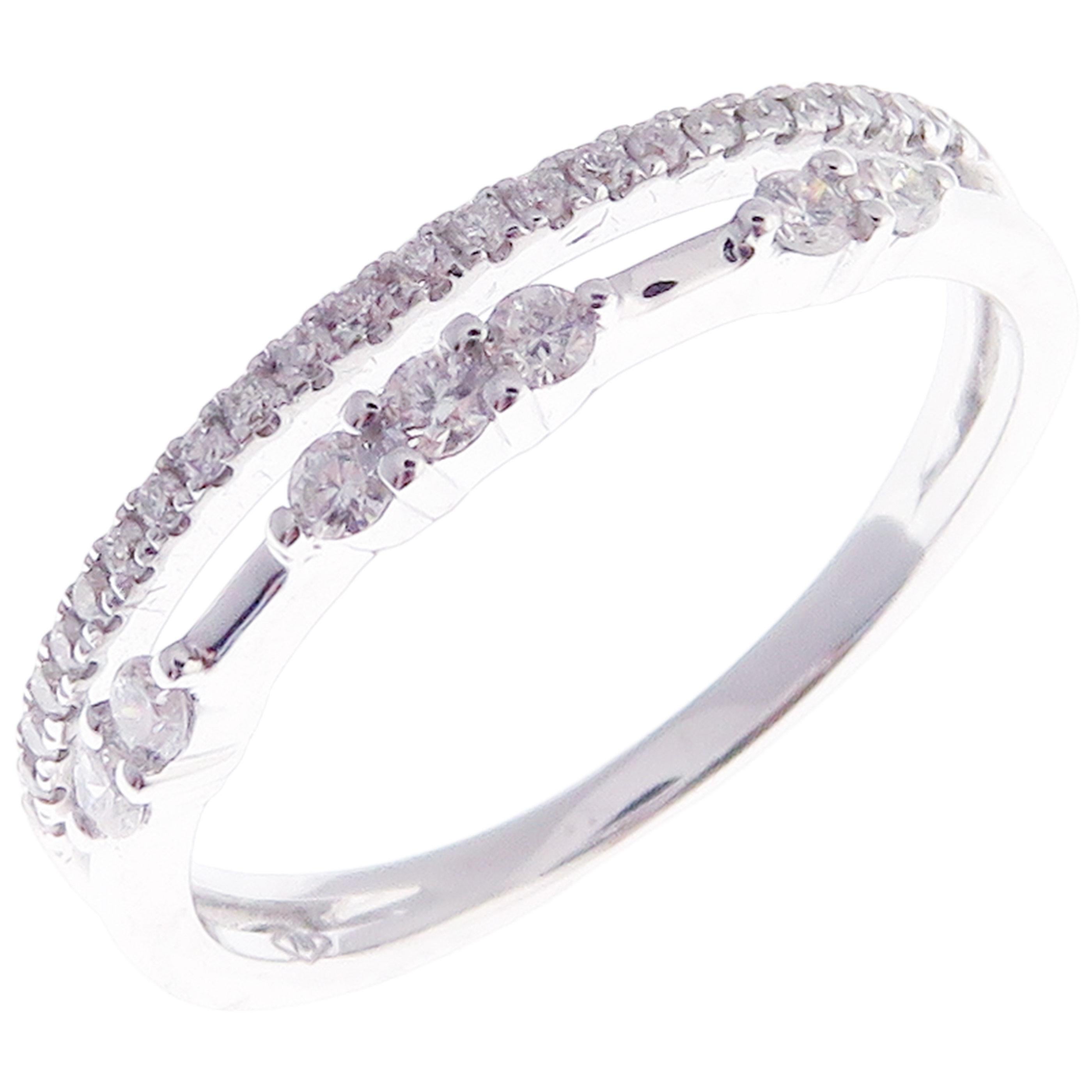 This trendy multi-layer  ring is crafted in 18-karat white gold, featuring 30 round white diamonds totaling of 0.30 carats.
Approximate total weight 2.84 grams.
Standard Ring size 7
SI-G Quality natural white diamonds.