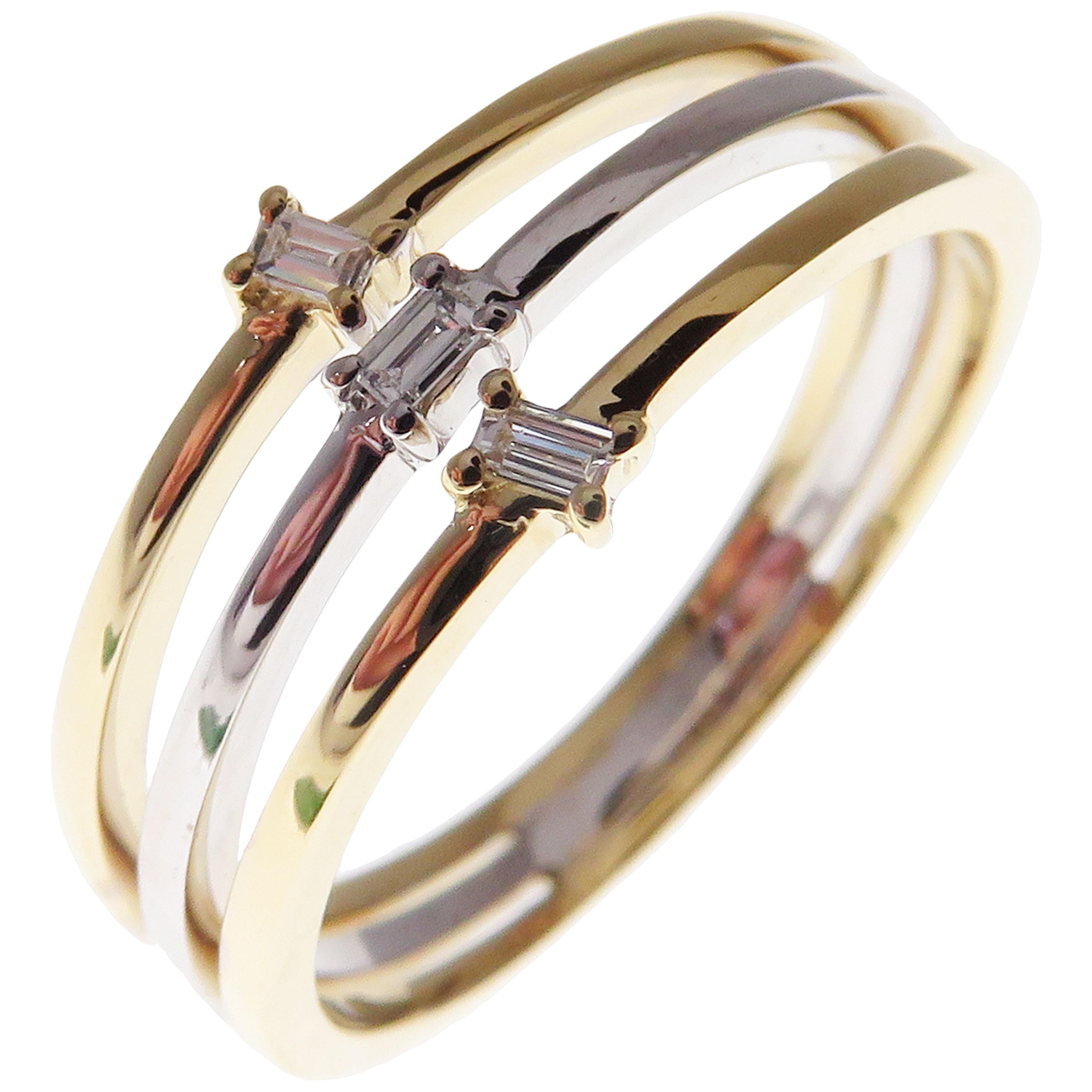 This trendy multi-layer ring is crafted in 18-karat two tone white gold and yellow gold, featuring 3 baguette white diamonds totaling of 0.08 carats.
Approximate total weight 3.34 grams.
Standard Ring size 7
SI-G Quality natural white diamonds.