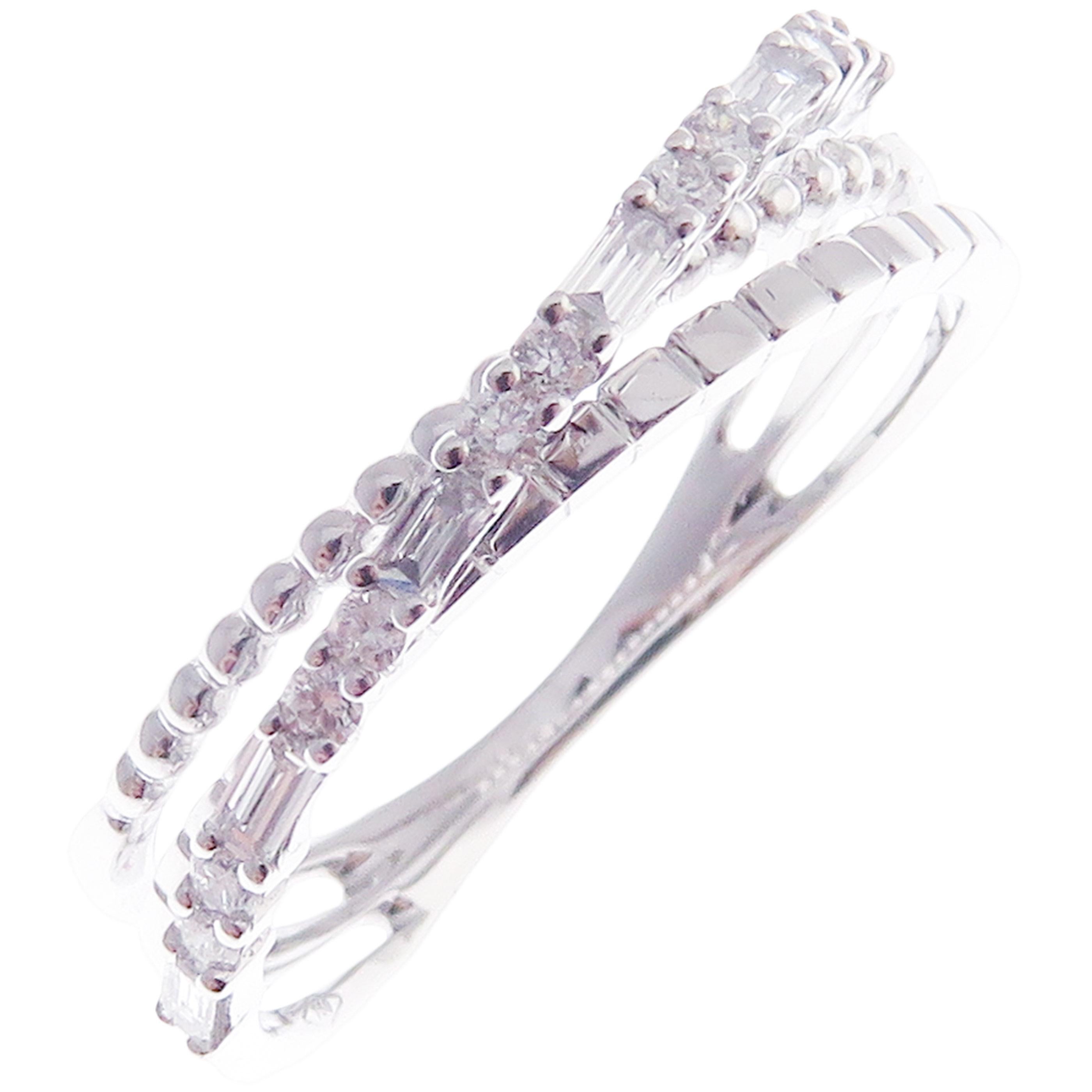 This trendy multi-layer X ring is crafted in 18-karat white gold, featuring 10 round white diamonds totaling of 0.11 carats and 6 baguette white diamonds totaling of 0.15 carats.
Approximate total weight 2.89 grams.
Standard Ring size 7
SI-G Quality