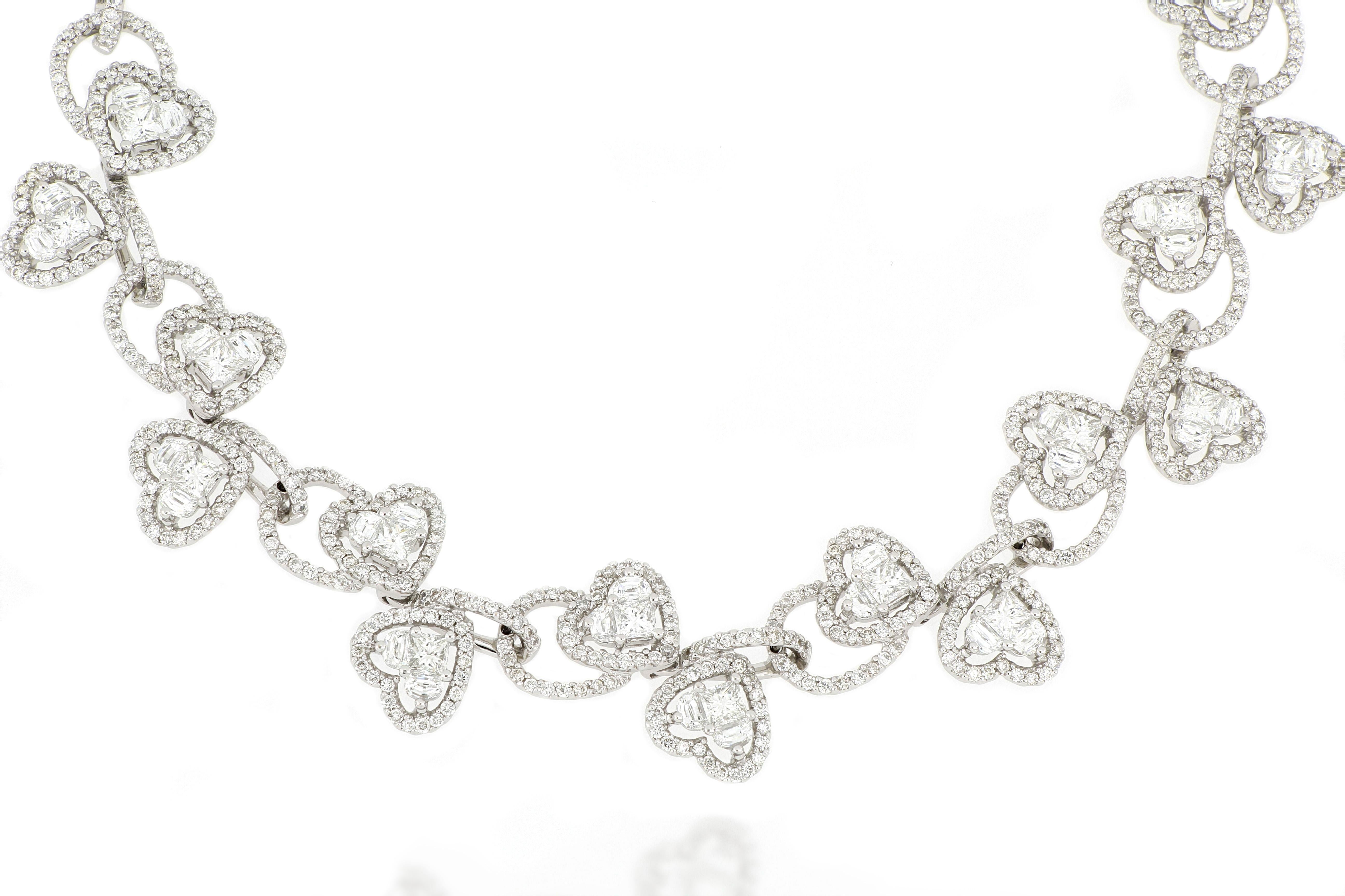 This fabulous diamond necklace is nicely designed with a structure composed of many heart shape pieces interlocked together. The entire necklace  is set with one thousand five hundred pieces of diamonds, weighing 12.88 carats in total, mounted in 18