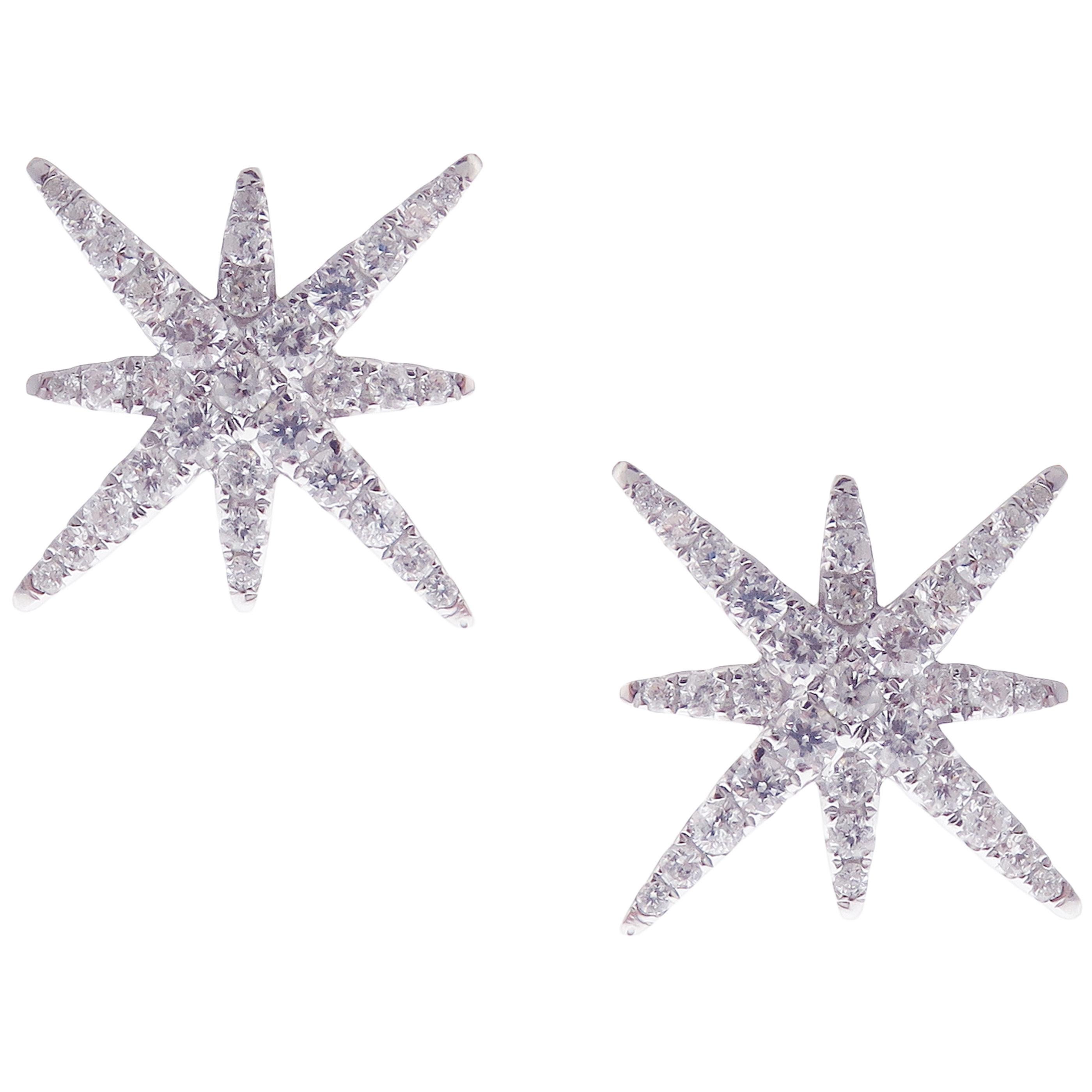 This diamond pave starburst stud earring is crafted in 18-karat white gold, featuring 66 round white diamonds totaling of 0.60 carats. 
Approximate total weight 2.50 grams.
These earrings come with push back post backings.
SI-G Quality natural white