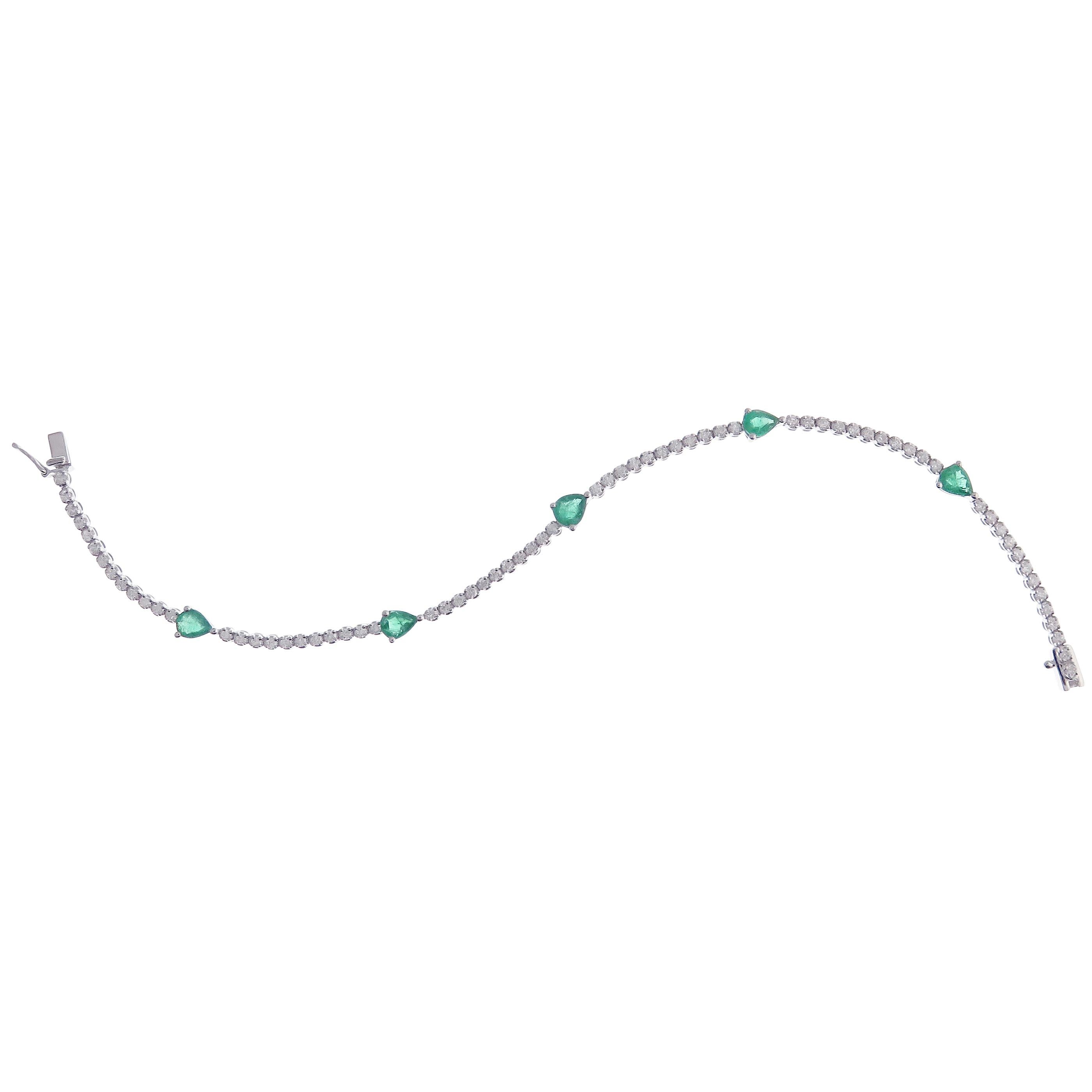 This white diamond and pear shape emerald line tennis bracelet is crafted in 18-karat white gold, featuring 70 round diamonds totaling of 1.10 carats VS quality, 5 pear shape emerald totaling of approximate 1.35 carats.

Bracelet is approximately 7