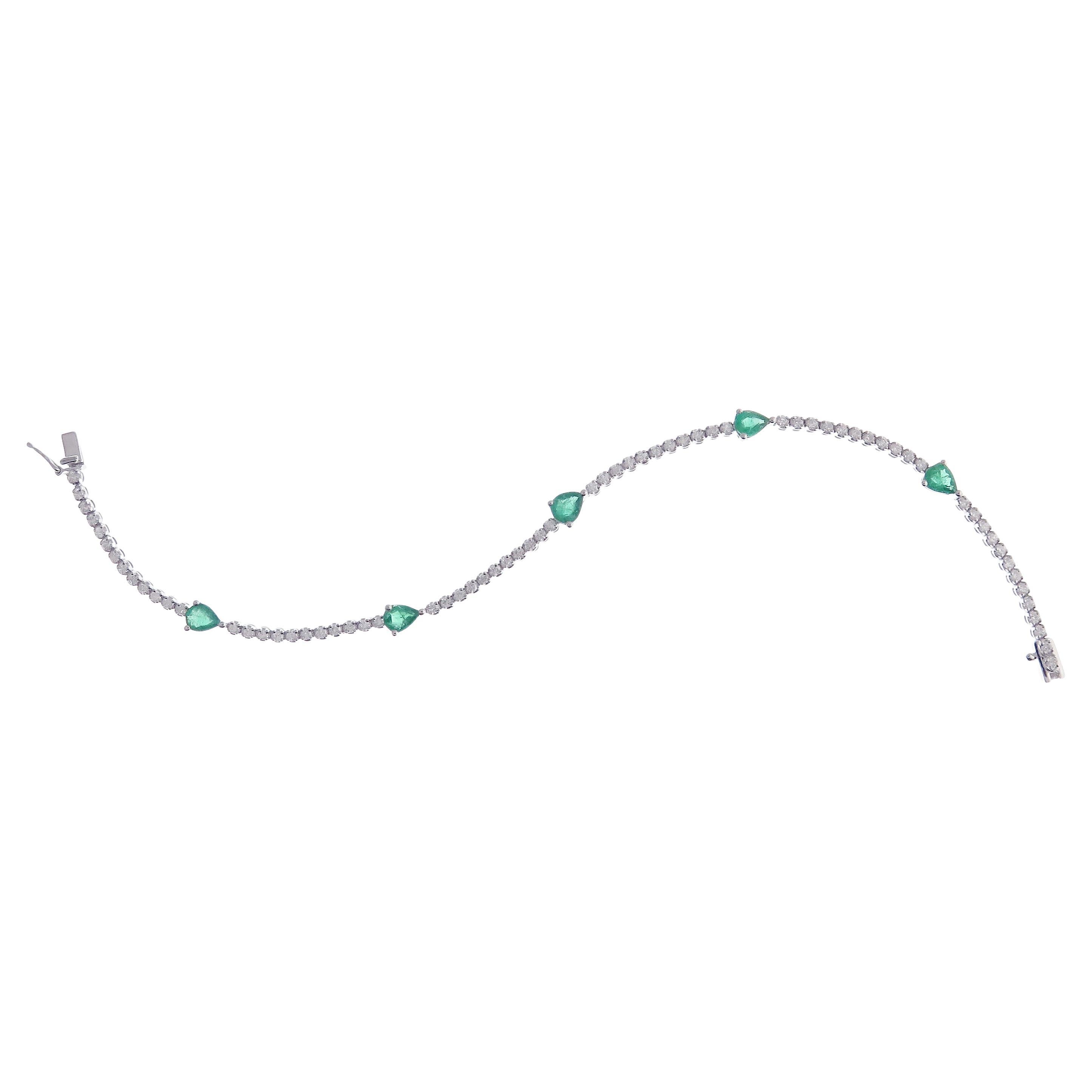 18 Karat White Gold Diamond Pear Shape Emerald Line Tennis Bracelet For Sale