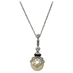 Antique 18 Karat White Gold Diamond Pearl and Onyx Pendant