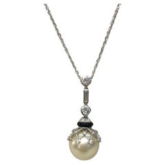 Pendentif en or blanc 18 carats, diamant, perle et onyx