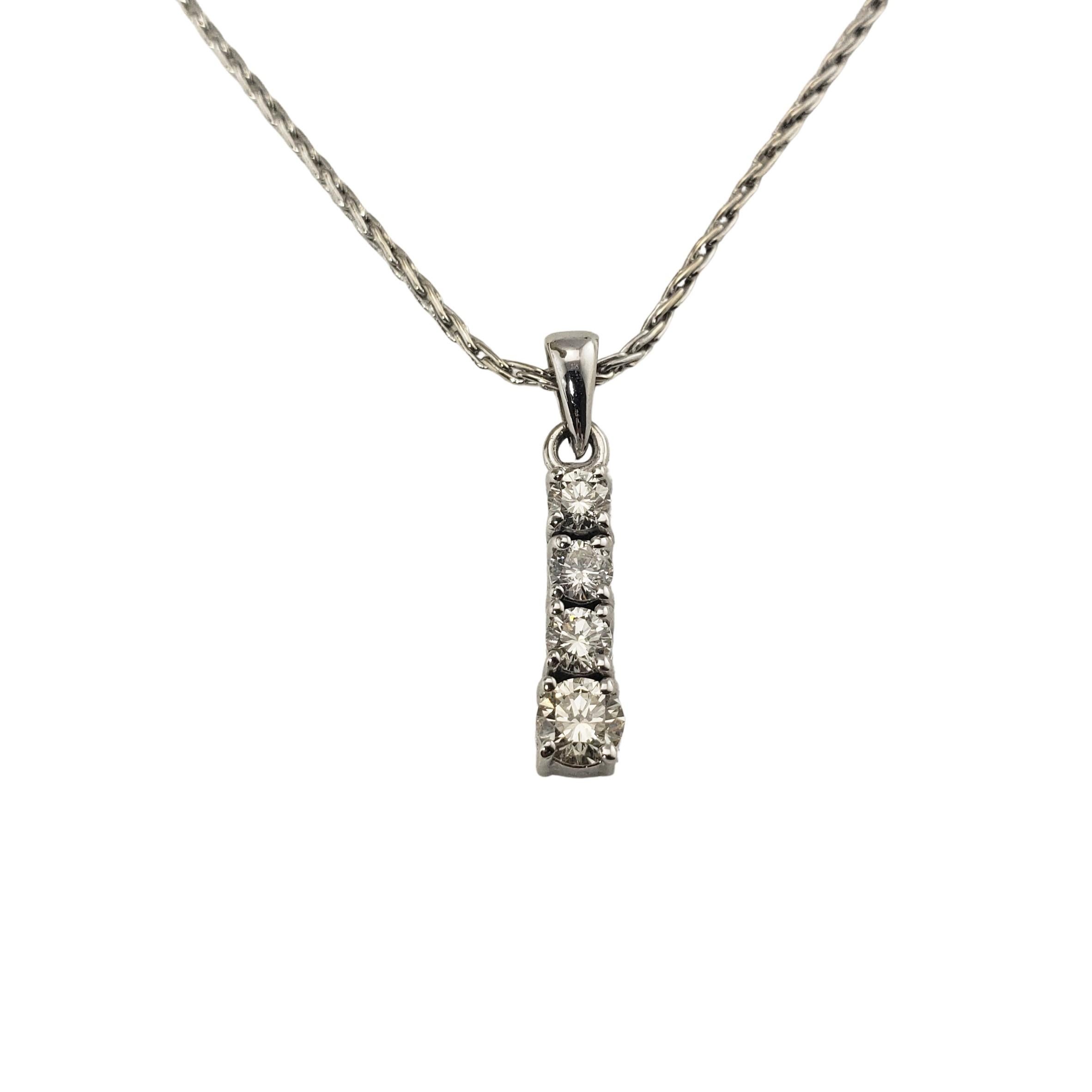 Vintage 18 Karat White Gold and Diamond Pendant Necklace-

This sparkling pendant features four round brilliant cut diamonds set in elegant 18K white gold. Suspends from a classic wheat necklace.

Approximate total diamond weight: .69 ct.

Diamond