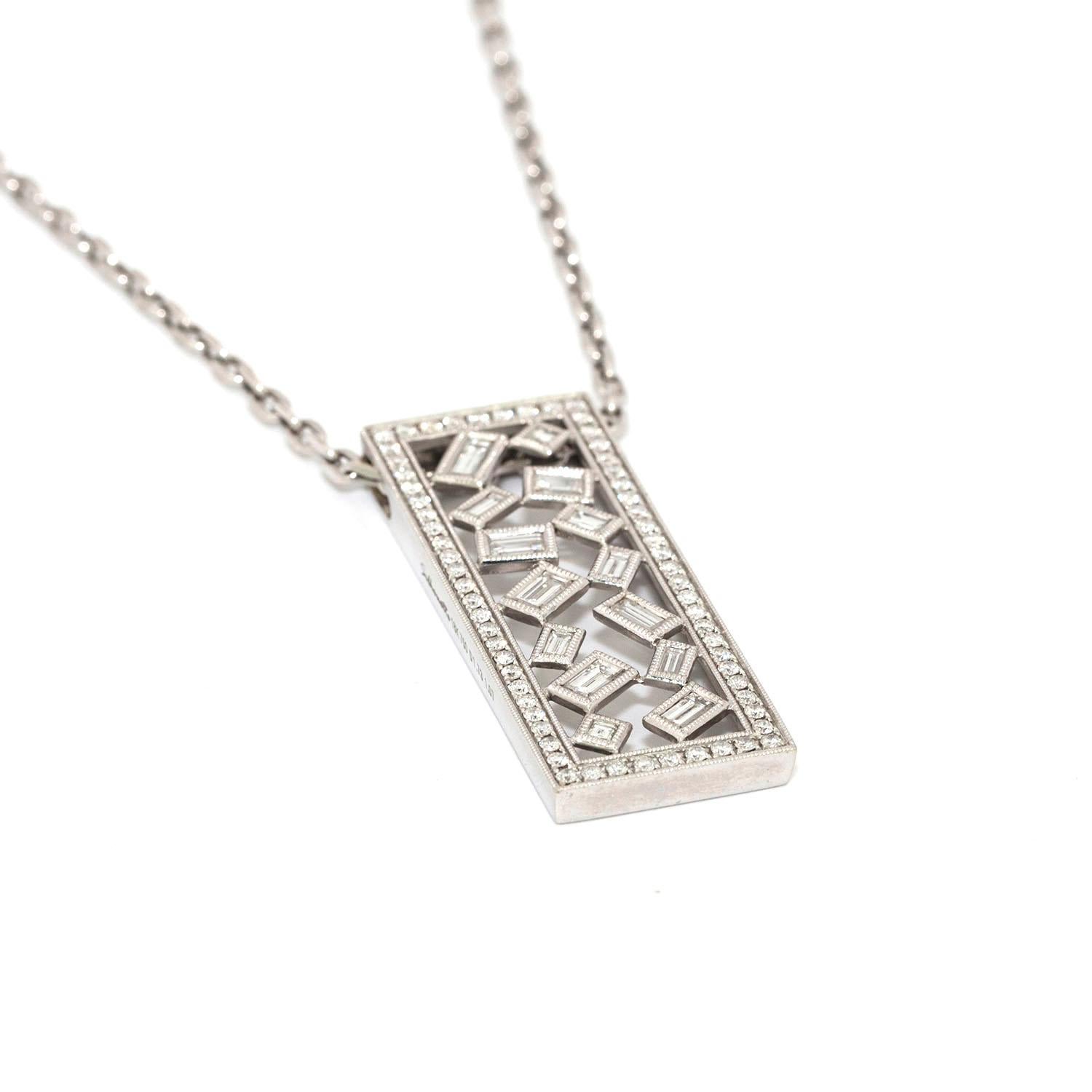 This unique pendant playfully displays 14 white emerald cut diamonds, with a total weight of over 1.70 carats.
the pendant is also set with 64 round white diamonds with total weight of over 1 carat.
4.5x1.70cm pendant measurements
stamp: silhouette