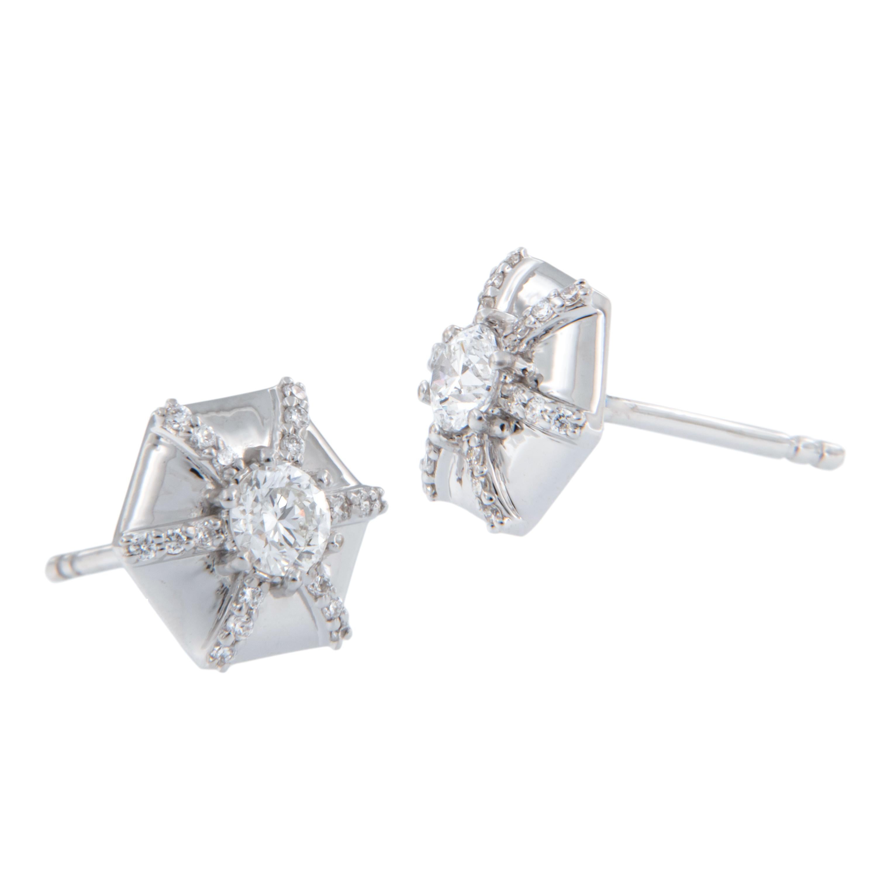 The Queen Collection was inspired by royalty, but with a modern twist. The diamonds represent the richness and passion of a true Queen. Made in royal 18k white gold these fetching hexagon stud earrings with 0.41 Cttw diamonds will be sure to make