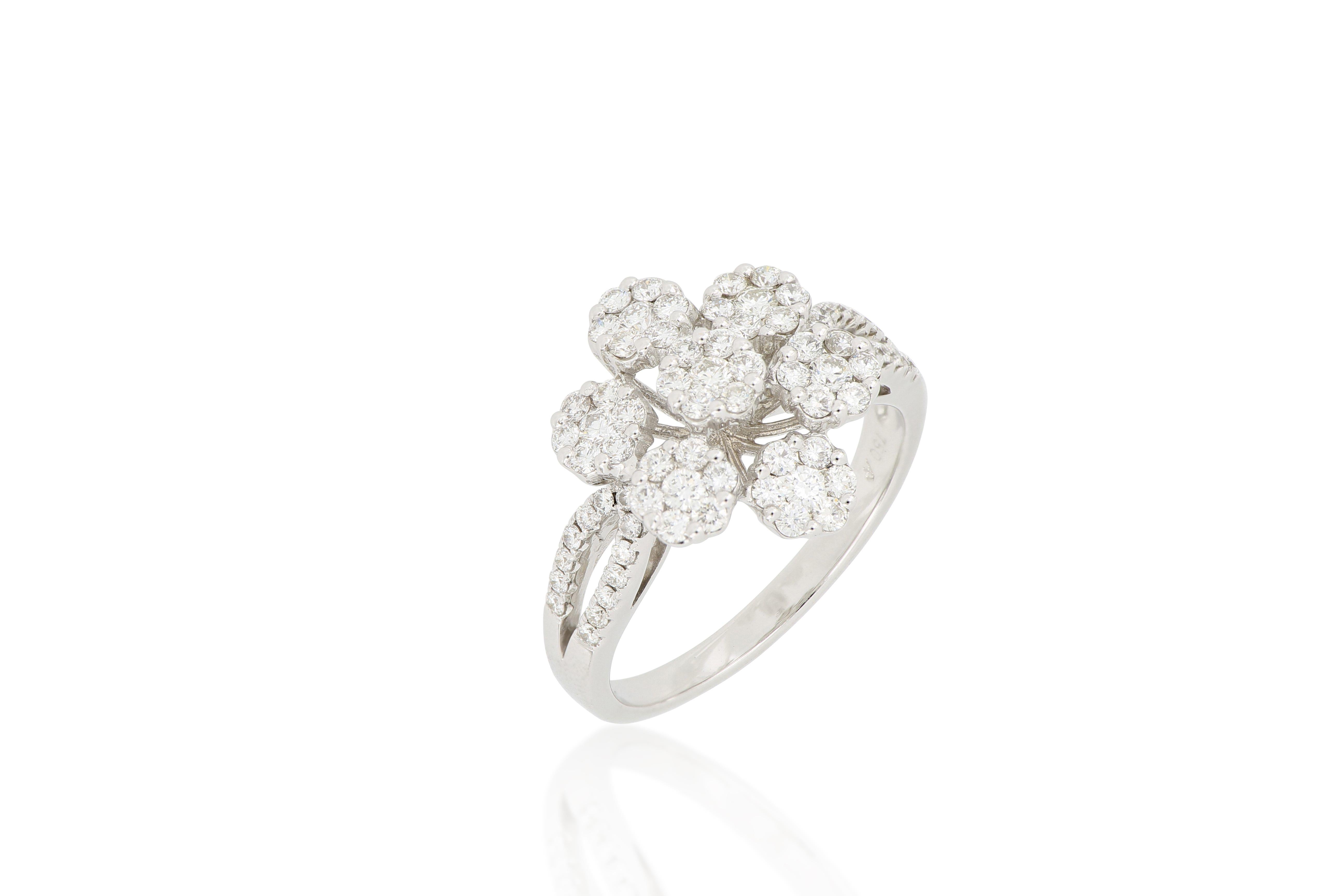A diamond ring, designed in a floral pattern , set with brilliant-cut diamonds weighing approximately 1.12 carats, mounted in 18 Karat white gold.
A beautiful ring which can be worn for any occasion.
The brand is renowned for its high jewellery