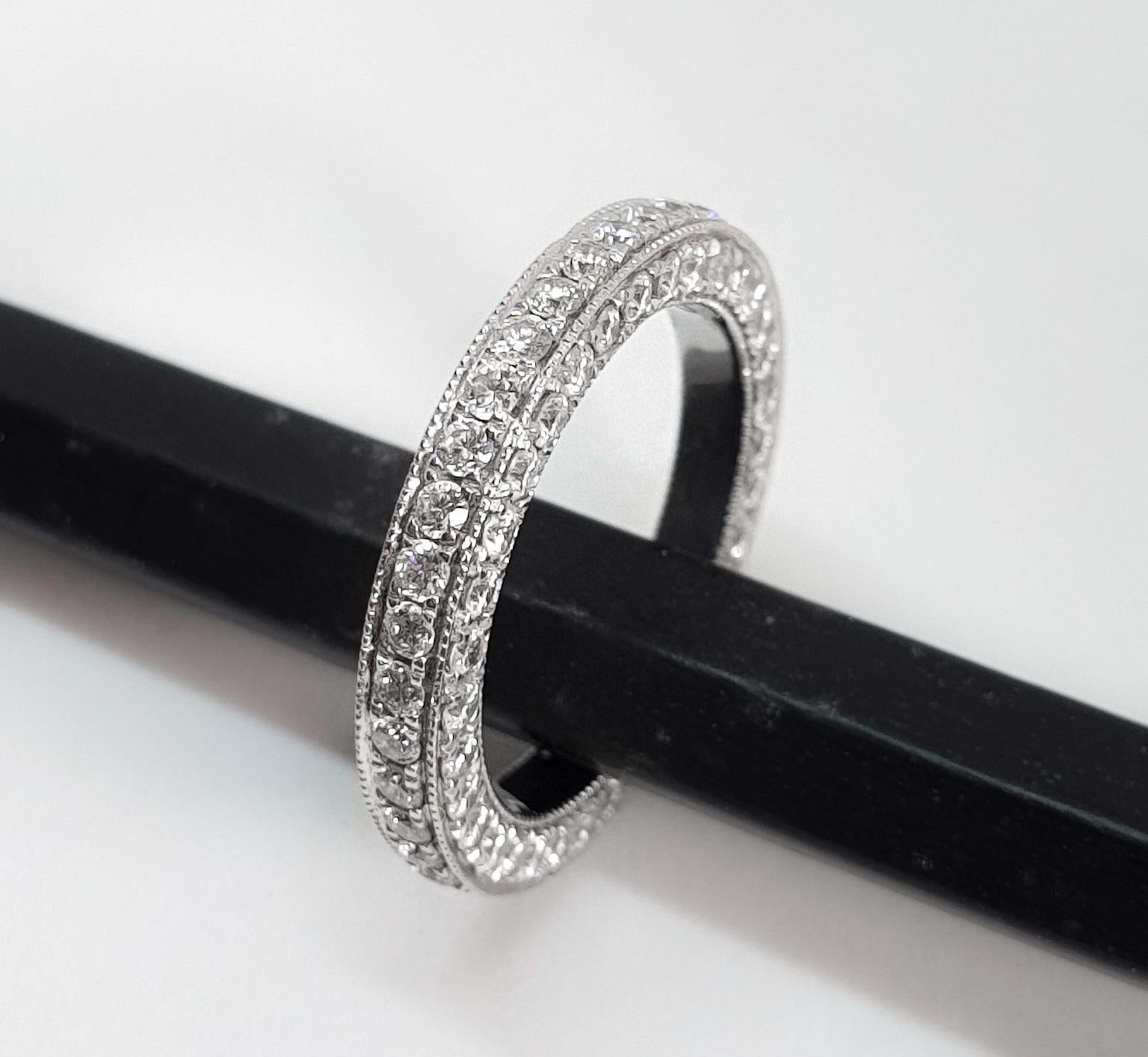 Inspired from the eternity band, this is a modified version of the same. Brilliant cut round diamonds are microscopically set on three sides of the band which are visually seen. The millgrain on each border adds to the detail.
This ring would look
