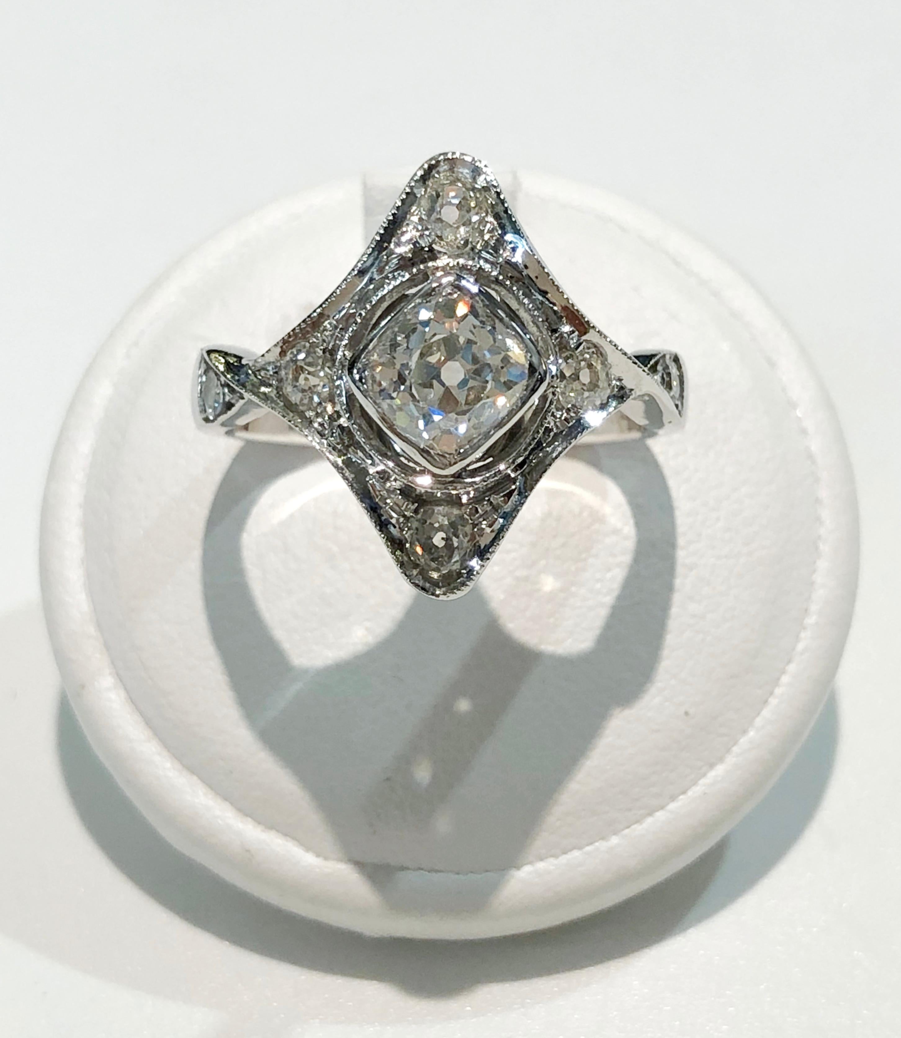 Vintage ring with 18 karat white gold band, with small brilliant diamonds for a total of 0.95 karats, and one large center diamond of 0.54 karats, Italy 1930s
Ring size US 7