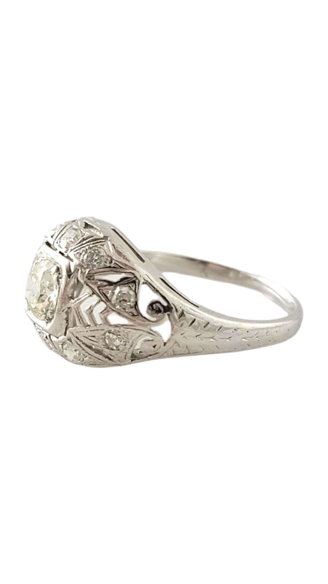 18 Karat White Gold and Diamond Ring Size 5.75

This elegant ring features one round brilliant cut diamond in its center: (.35 ct.), two round brilliant cut diamonds and eight round single cut diamonds set in beautifully 18K white gold. 

 Width: 11