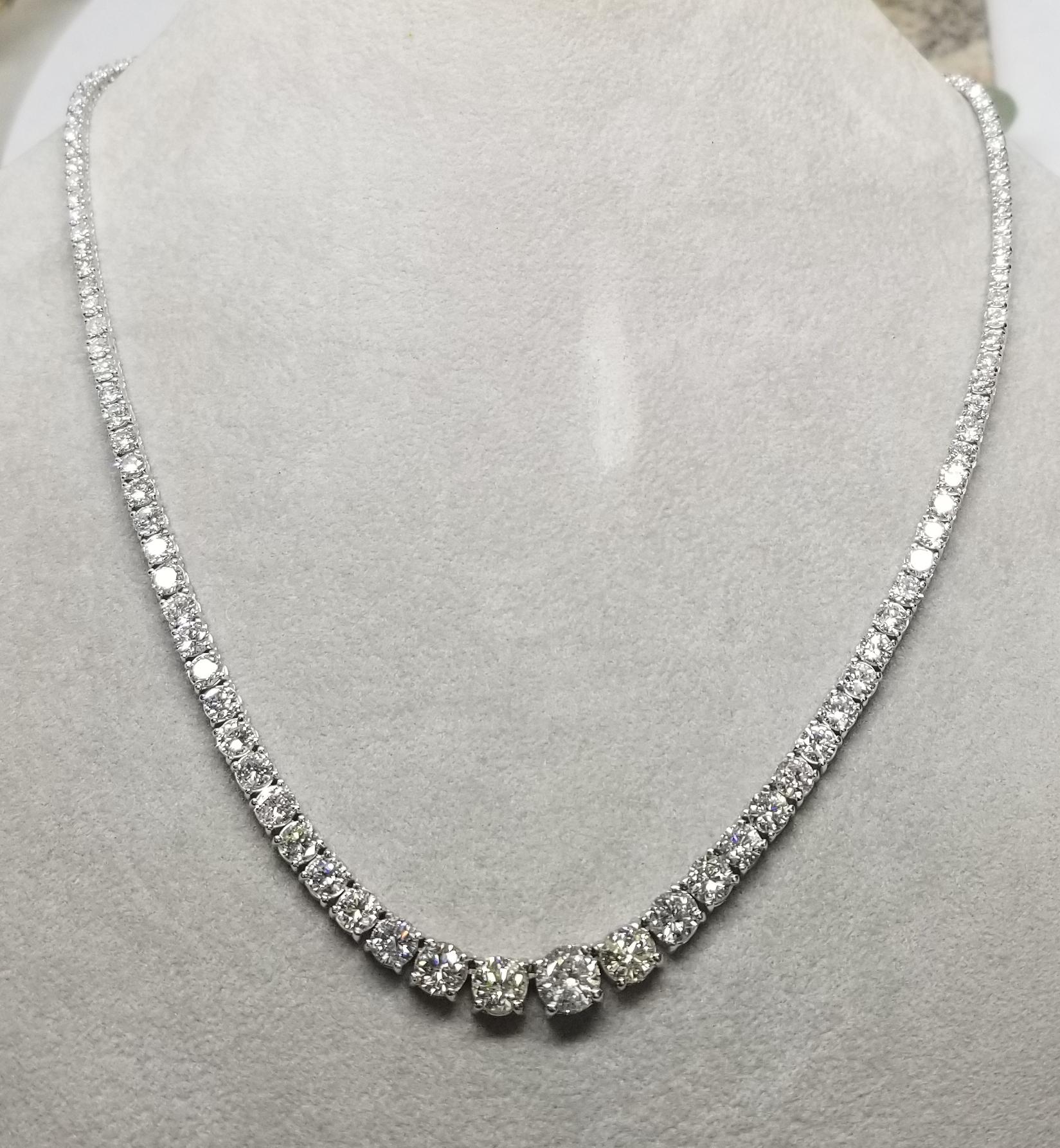 Bring the elegance of your style with this stunning diamond riviera tennis necklace. This piece has 133 pieces of diamonds in 17.79 carat total weight, G-H color and SI1-SI3 in clarity, crafted in 18k white gold.  the center diamond  weighs 1.02cts.