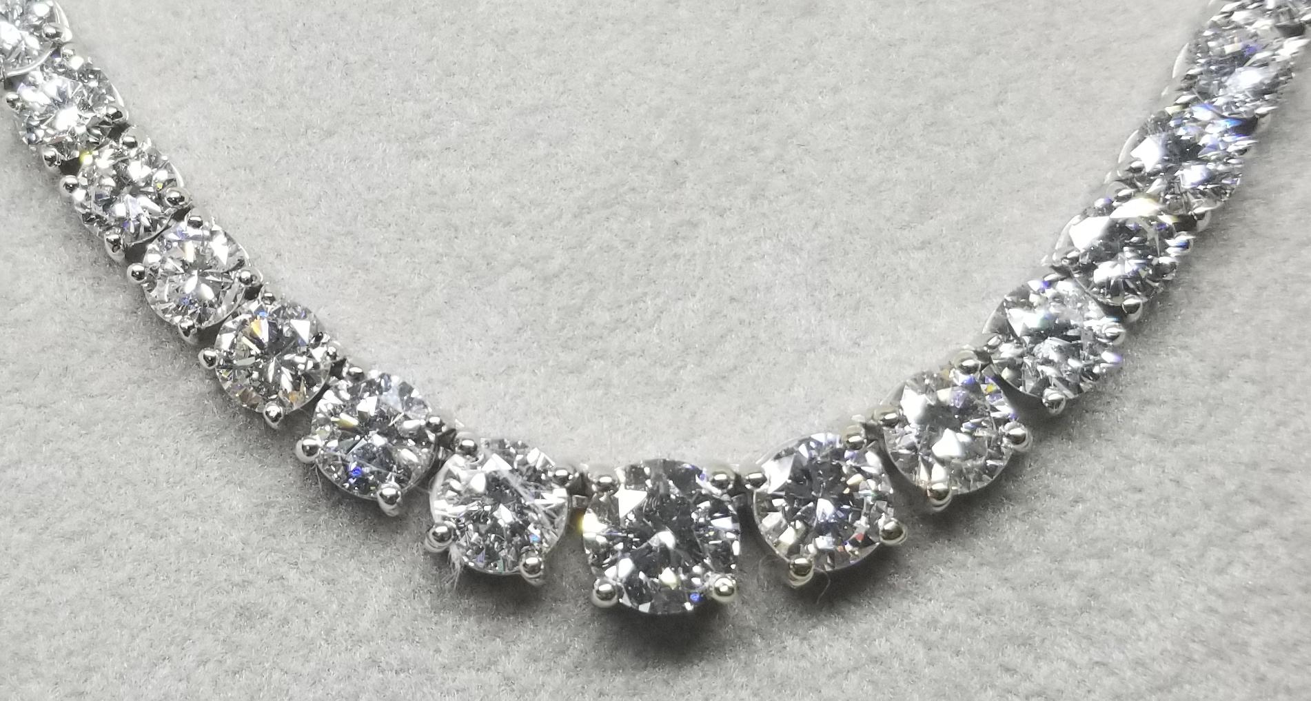 Bring the elegance of your style with this stunning diamond riviera tennis necklace. This piece has 119 pieces of diamonds in 21.88 carat total weight, F/G color and VS2-SI in clarity, crafted in 18k white gold.  the center diamond  weighs