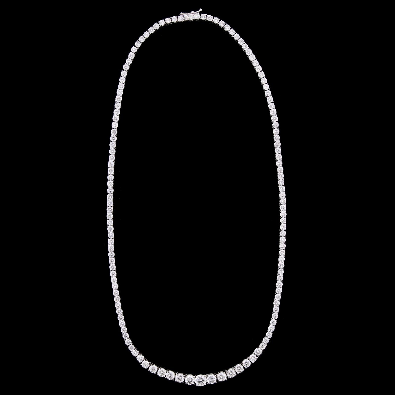 18K White Gold Diamond Riviere. The necklace is set with 132 graduated round
brilliant cut diamonds, approximate total wt. 12.00cts., HI color, SI clarity, length 16 1/2