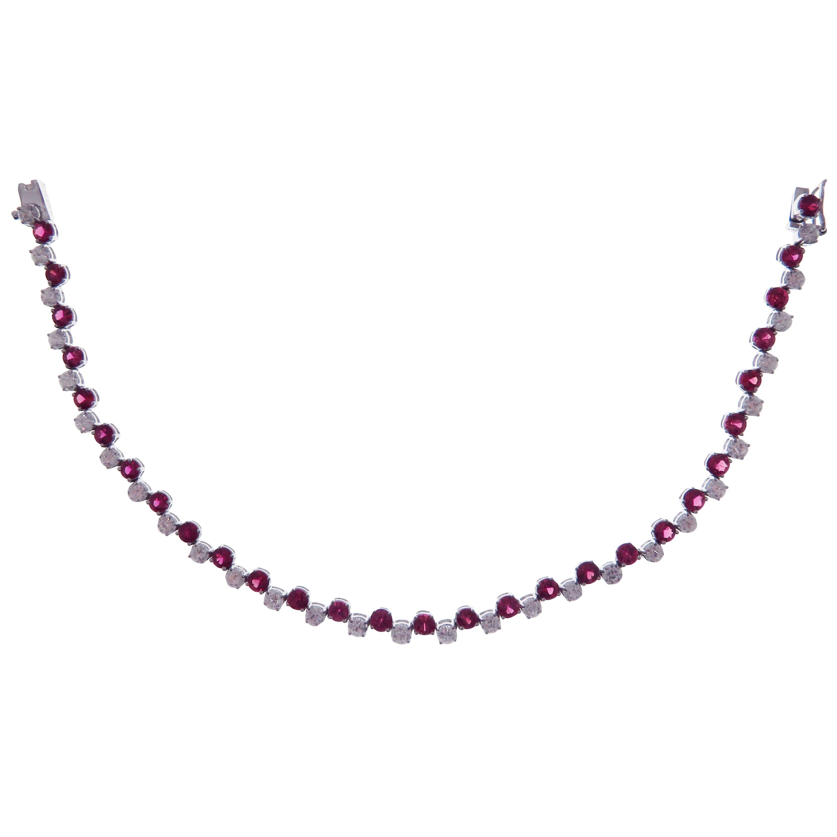 This bracelet is crafted in 18-karat white gold, weighing approximately 2.20 total carats of SI Quality white diamonds and 3.70 total carats of Ruby stones. 

Bracelet is approximately 7